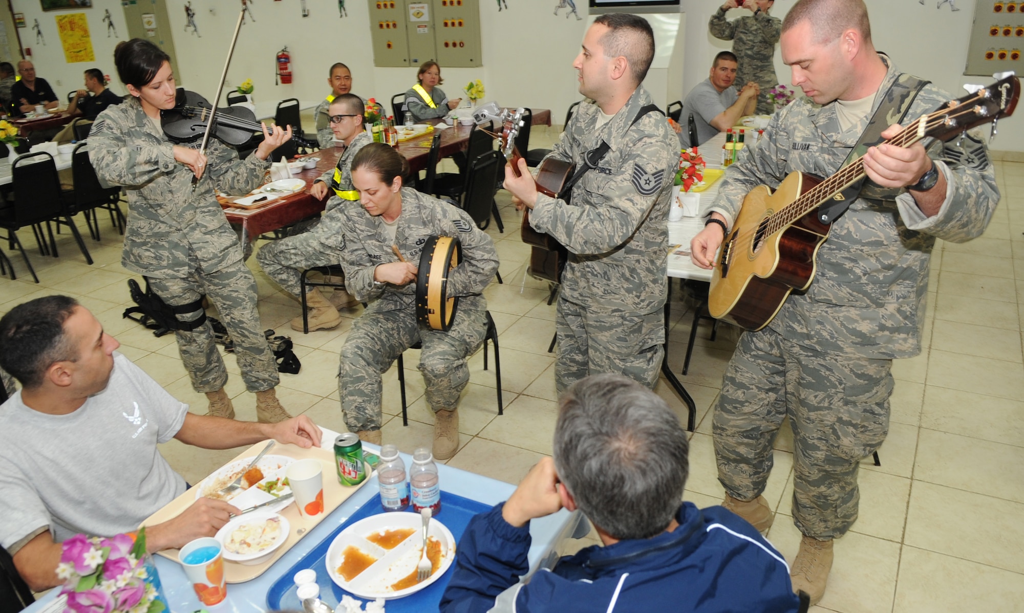 KIRKUK REGIONAL AIR BASE, Iraq – U.S. Air Forces Central Band Celtic Aire perform traditional Celtic tunes for Airmen and Soldiers at the dining facility Jan. 17, 2010.  The AFCENT band travels to many deployed locations to offer foot-stomping, energetic instrumentals as well as heart-warming ballads for U.S. forces around the world.  (U.S. Air Force photo/Staff Sgt. Tabitha Kuykendall)	