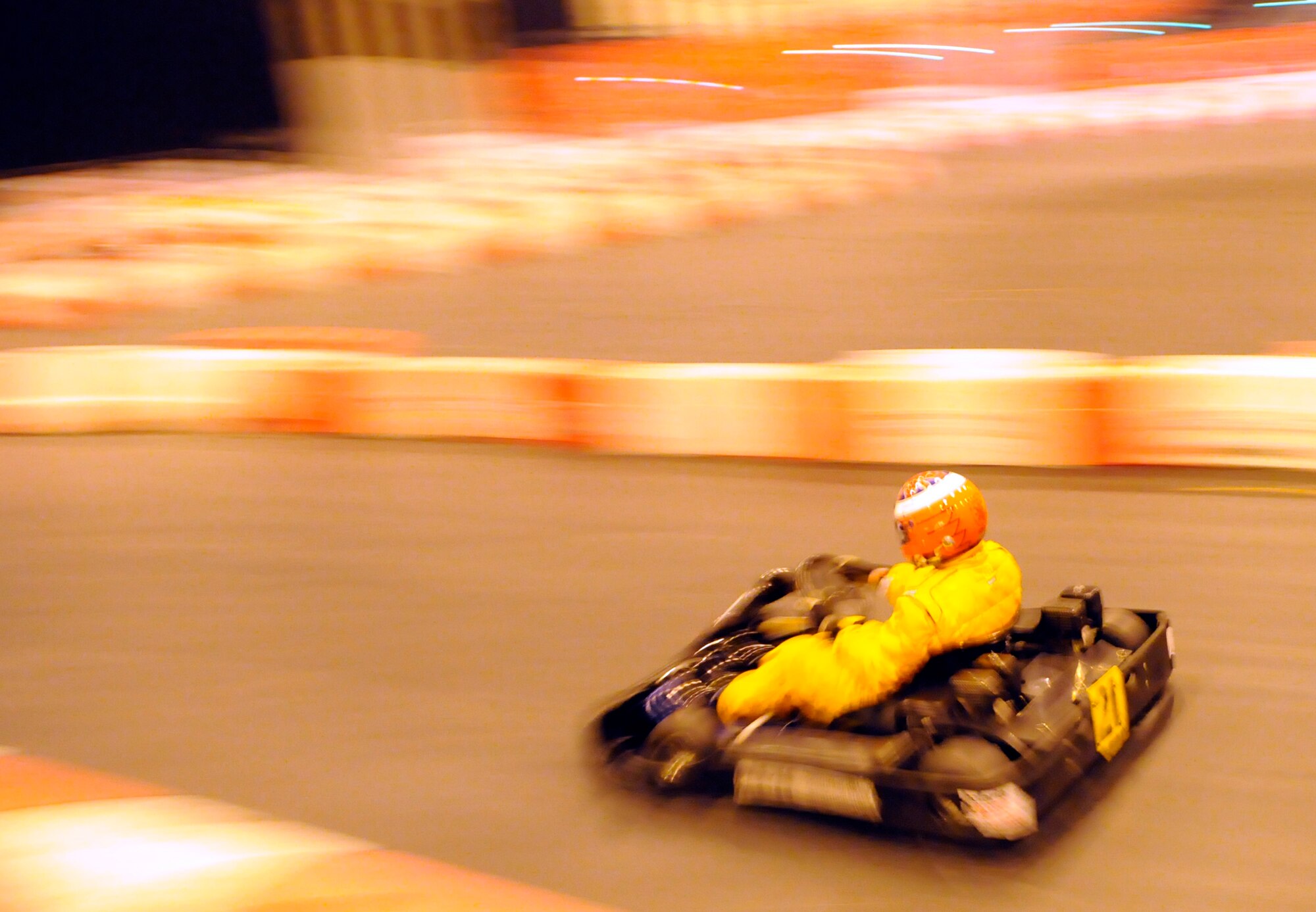 BIRMINGHAM, England -- Tech Sgt. RaileR Cantrell, driving for the Auto Sports team, zips through a straightaway during a Racing for Charity kart race to raise funds for Cure for Malaria United Kingdom Jan. 15.  Sergeant Cantrell competed alongside professional and amateur drivers spanning nearly every type of motor sport.  (U.S. Air Force photo/Staff Sgt. Christopher L. Ingersoll)