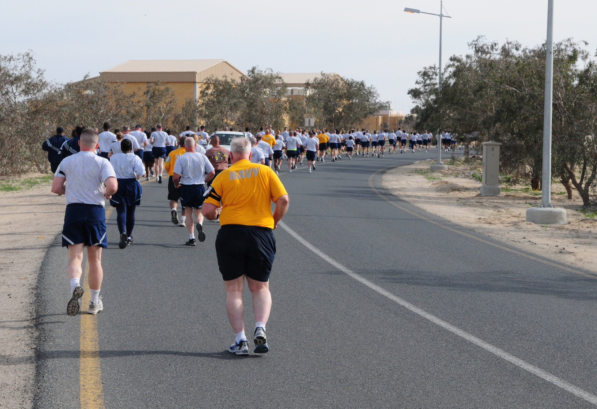 Armed Forces MLK run participants take off on the 10- and 5-kilometer course Jan. 18, 2010 at an air base in Southwest Asia. About 150 servicemembers, Department of Defense civilian and contract personnel and coalition partners participated in the race honoring Martin Luther King Jr. The event was sponsored by HFP Racing. (U.S. Air Force photo by Staff Sgt. Robert Sizelove/Released)