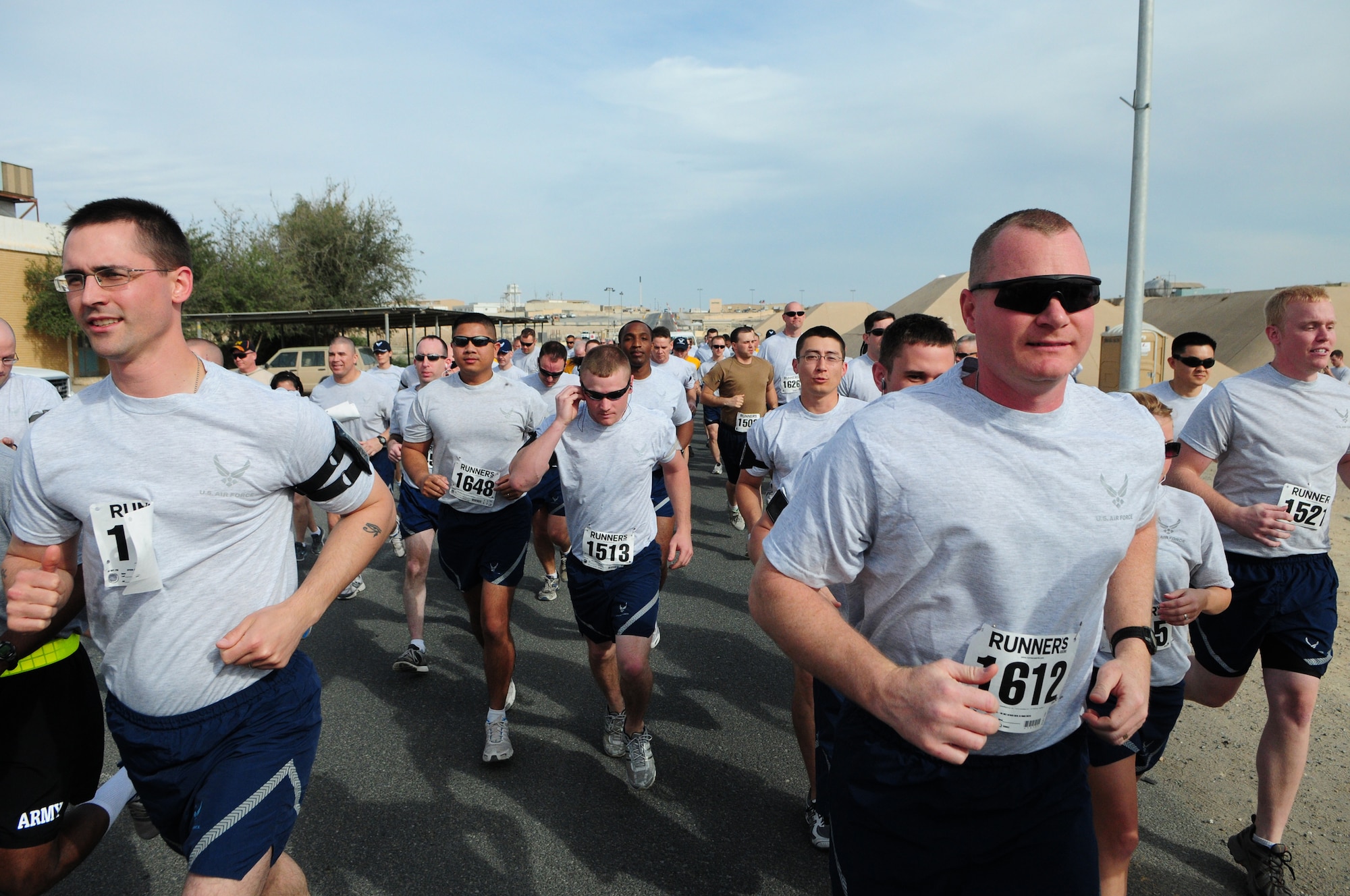 Participants begin the 10- and 5-kilometer Armed Forces MLK run Jan. 18, 2010 at an air base in Southwest Asia. About 150 servicemembers, Department of Defense civilian and contract personnel and coalition partners participated in the race honoring Martin Luther King Jr. The event was sponsored by HFP Racing. (U.S. Air Force photo by Staff Sgt. Robert Sizelove/Released)