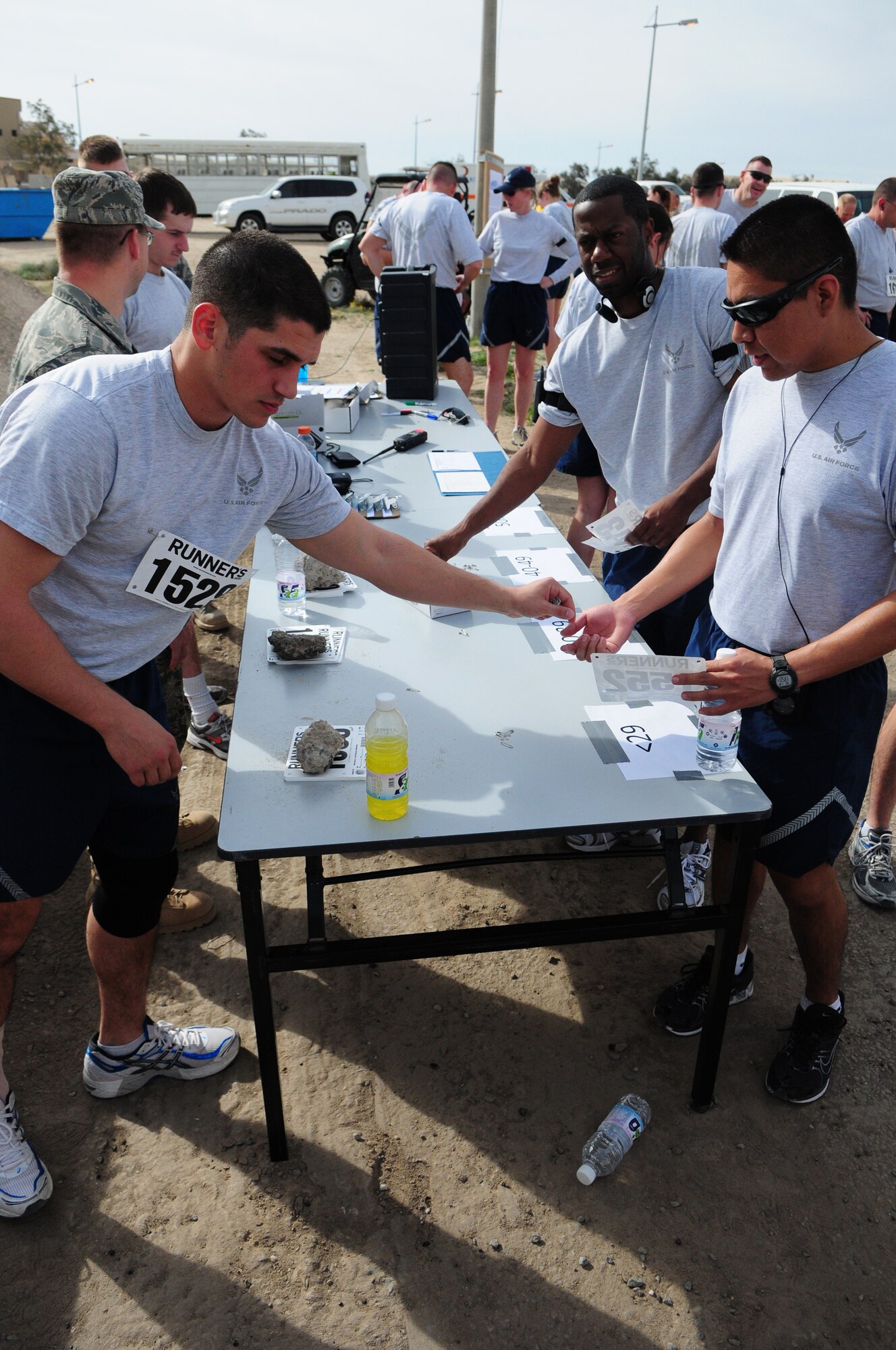 U.S. Air Force Staff Sgt. Adam Borrello, 386th Expeditionary Force Support Squadron, registers Armed Forces MLK run participants before the event Jan. 18, 2010 at an air base in Southwest Asia. About 150 servicemembers, Department of Defense civilians and contract personnel and coalition partners participated in the 10- and 5-kilometer race honoring Martin Luther King Jr. The event was sponsored by HFP Racing. (U.S. Air Force photo by Staff Sgt. Robert Sizelove/Released)