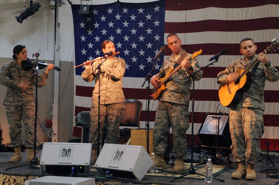 The band Celtic Aire performed at Joint Base Balad, Iraq, Jan 14, 2010. Celtic Aire is the grass-roots folk music component of the U.S. Air Force Band located at Bolling Air Force Base, D.C. The members are Tech. Sgt. Emily Lewis, violinist/vocalist, Tech. Sgt. Julia Brundage, vocalist/drums, Master Sgt. Eric Sullivan, guitarist/vocalist, and Tech. Sgt. Joseph Haughton, guitarist/vocalist. (U.S. Air Force photo/Senior Airman Brittany Y. Bateman/Released) 