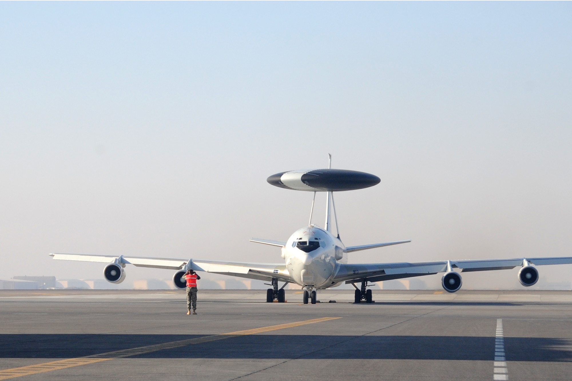 A E-3 Sentry Airborne Warning and Control System aircraft taxis out to the runway at an undisclosed location in Southwest Asia on Jan. 16.The E-3 Sentry is a modified Boeing 707/320 commercial airframe with a rotating radar dome that provides situational awareness of friendly, neutral and hostile activity, command and control of an area of responsibility, battle management of theater forces, all-altitude and all-weather surveillance of the battle space, and early warning of enemy actions during joint, allied, and coalition operations. (U.S. Air Force photo/Senior Airman Jenifer H. Calhoun/Released)
