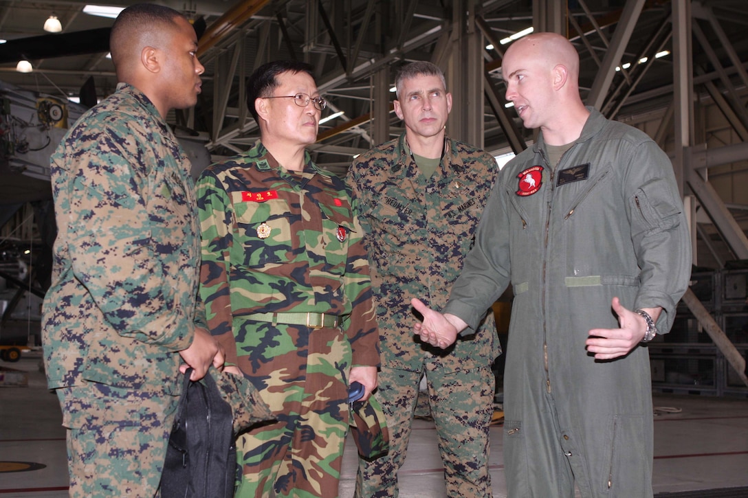 Capt. Nicholas J. Harvey, a pilot with Marine Heavy Helicopter Squadron 465, explains Marine Corps operations of a CH-53E “Super Stallion” to Sgt. Maj. Michael W. Redmyer, sergeant major for U.S. Marine Corps Forces, Korea, Republic of Korea Sgt. Maj. In-ho Seo and Sgt. Alan H. Anderson, a Korean linguist. Seo visited Marine Corps Air Station Miramar to see the components that support flight operations at an air station. Seo is set to visit Marine Corps Recruit Depot San Diego, Marine Corps Base Camp Pendleton and Marine Corps Air Ground Combat Center Twentynine Palms during his two week visit.