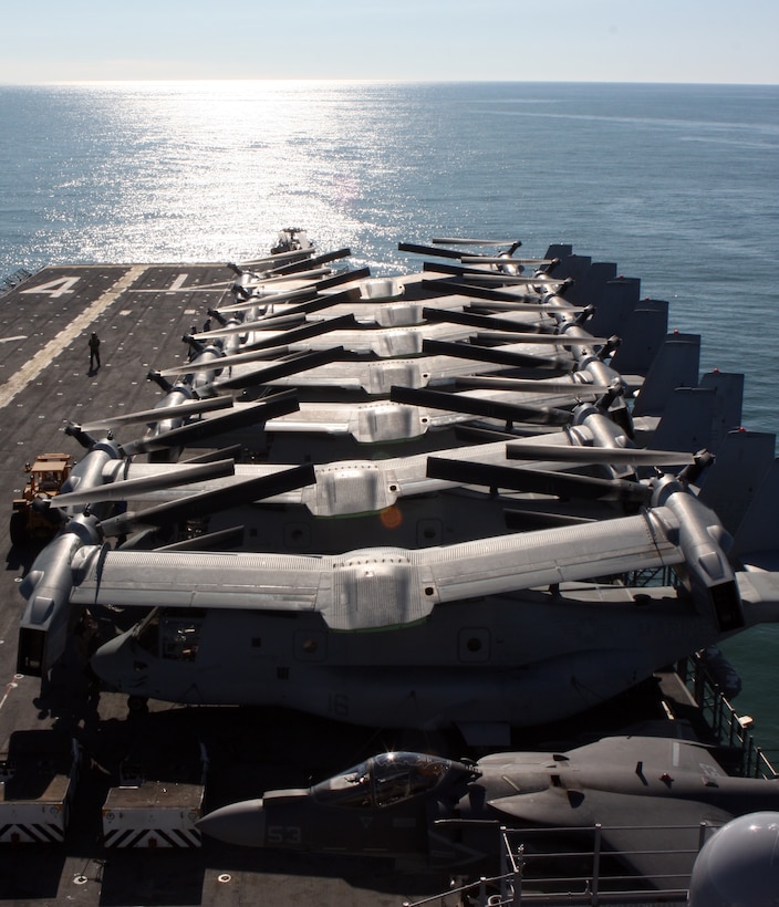 MV-22 Ospreys from Marine Medium Tilt Rotor Squadron 162 (Reinforced), 24th Marine Expeditionary Unit, quietly remain full stowed on the flight deck of USS Nassau on Jan. 19 for their upcoming deployment.  24th MEU Marines and Sailors embarked vessels of the Nassau Amphibious Ready Group, marking the onset of their six-month deployment. The 24th MEU is among the most versatile military units in the world and stands ready to perform a full spectrum of missions ranging from humanitarian relief to full-scale combat operations.  (U.S. Marine Corps photo by Sgt. Alex C. Sauceda)