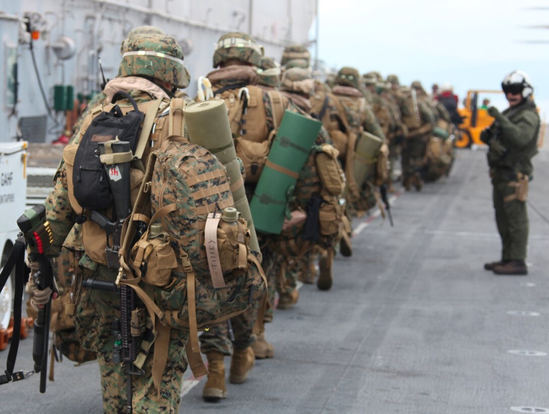 Marines with 3rd Battalion, 2nd Marine Regiment, Battalion Landing Team, 22nd Marine Expeditionary Unit prepare to board CH-53E Super Stallions from Marine Heavy Helicopter Squadron 461 (Reinforced), 22nd MEU for their mission to Haiti, Jan. 19, 2010. The 22nd MEU is embarked aboard the ships of the Bataan Amphibious Ready Group near the island of Haiti to provide humanitarian assistance and disaster relief in the wake of a devastating earthquake that struck the country Jan. 12, 2010.