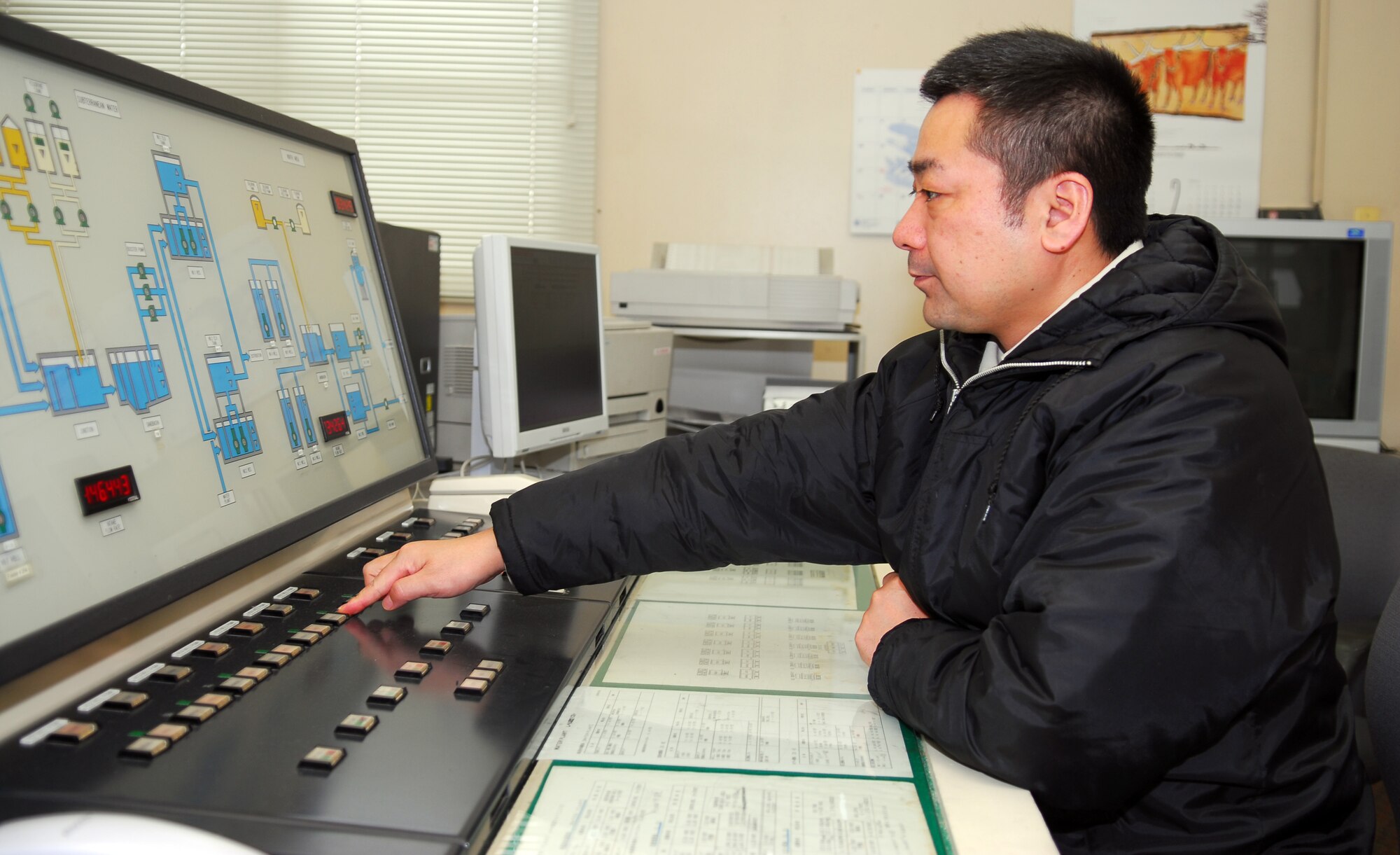 Katsuhiko Baba, 35th Civil Engineer Squadron water reservoir plant operator, checks the plant’s secondary water pump system Jan.20 at the main base water storage area. The main base water storage area is a water reservoir that contains approximately 500,000 gallons of potable water. (U.S. Air Force photo/Staff Sgt. Phillip Butterfield)

