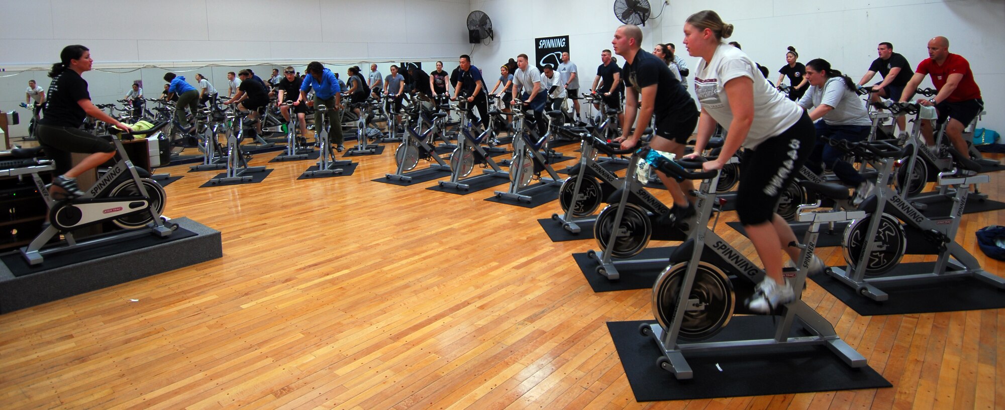 Service members from around Misawa participate in a spin class Jan. 20 at the Potter Fitness Center. Spin is a program that gives service members an alternative to running on the treadmill or track for an aerobic workout. Spin is an hour- long class, using stationary bikes and high-energy music. (U.S. Air Force photo/Staff Sgt. Phillip Butterfield)

