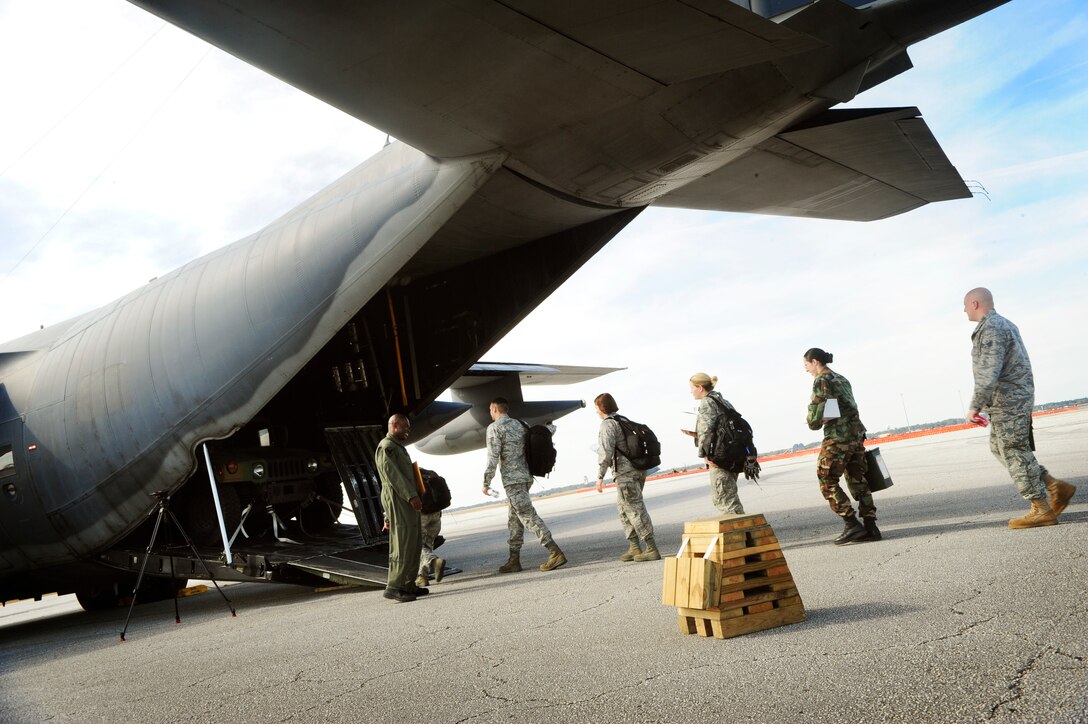 The 6th Medical Group Mobile Aeromedical Staging Facility (MASF) team boards a C-130 aircraft for humanitarian relief to Haiti from MacDill Air Force Base, Fla., Jan. 20. The 13-personnel MASF team from MacDill contains nurses, aeromedical technicians, and administrators who will provide medical treatment to victims of the massive Haiti earthquake which occured on Jan. 12. (U.S. Air Force photo by Senior Airman Rylan Albright)