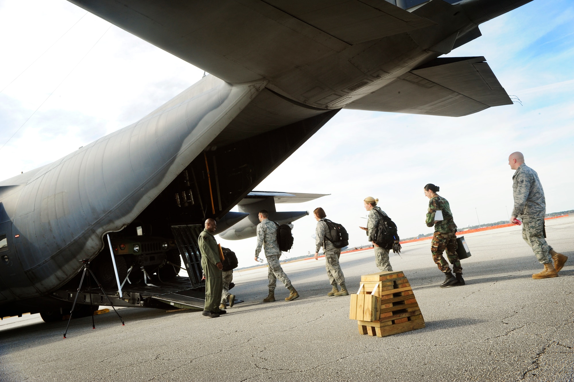 The 6th Medical Group Mobile Aeromedical Staging Facility (MASF) team boards a C-130 aircraft for humanitarian relief to Haiti from MacDill Air Force Base, Fla., Jan. 20. The 13-personnel MASF team from MacDill contains nurses, aeromedical technicians, and administrators who will provide medical treatment to victims of the massive Haiti earthquake which occured on Jan. 12. (U.S. Air Force photo by Senior Airman Rylan Albright)