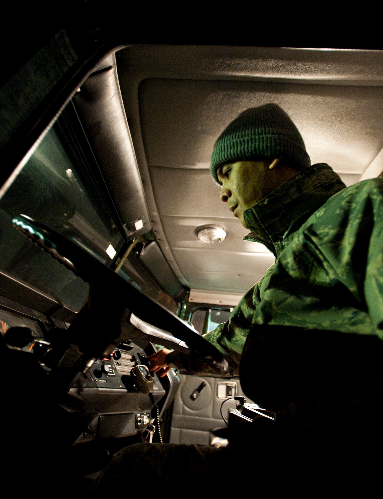 MISAWA AIR BASE, Japan -- Staff Sgt. Dennis Orejudos, 35th Logistics Readiness Squadron fuels expeditor, starts an R-11 fuel truck outside the fuels service center Jan. 19. When the temperature drops below 32 F, the fuels expeditor starts all the fuel trucks to keep the engines warm and useable. (U.S. Air Force photo/Staff Sgt. Samuel Morse)