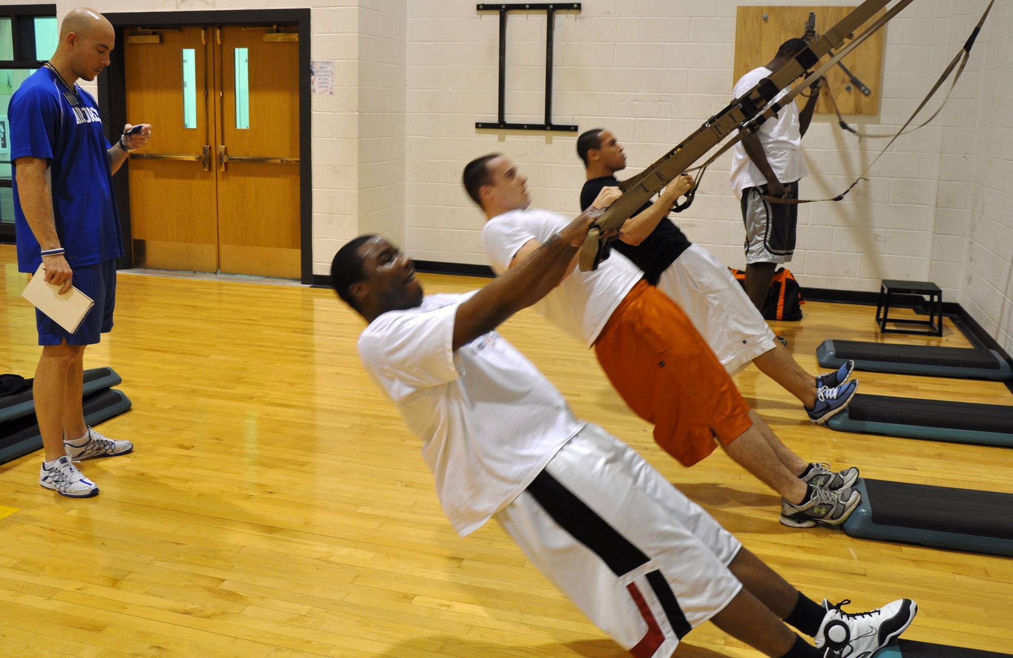 Brent Ragsdale (left), a HAWC health fitness specialist, times players from the Sheppard Senator Varsity Basketball team as they make their way through the Cross Fit work out Dec. 19 at the Pitsenbarger Fitness Center. The HAWC provides all programs and services free of charge. A health care provider may refer patients to a class at the HAWC or people can self register by calling 676-4292. (U.S. Air Force Photo / Airman 1st Class Adawn Kelsey)