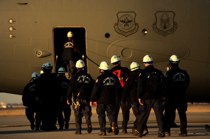 Members of Virginia Task Force 2 Urban Search and Rescue board a C-17 Globemaster III aircraft from Charleston Air Force Base, S.C., Jan. 15, 2010, in Norfolk, Va., for transport to Haiti for earthquake relief operations. The capabilities of the task force include physical search and rescue operations in damaged or collapsed structures; emergency medical care for trapped victims; task force members and search canines; reconnaissance to determine damage and provide damage assessments for local, state and federal officials; survey and evaluation of hazardous materials situations; structural and hazard evaluations of buildings needed for immediate occupancy to support disaster relief operations; and stabilization of damaged structures that include shoring and cribbing operations. (U.S. Air Force photo by Master Sgt. Jeremy Lock/Released)