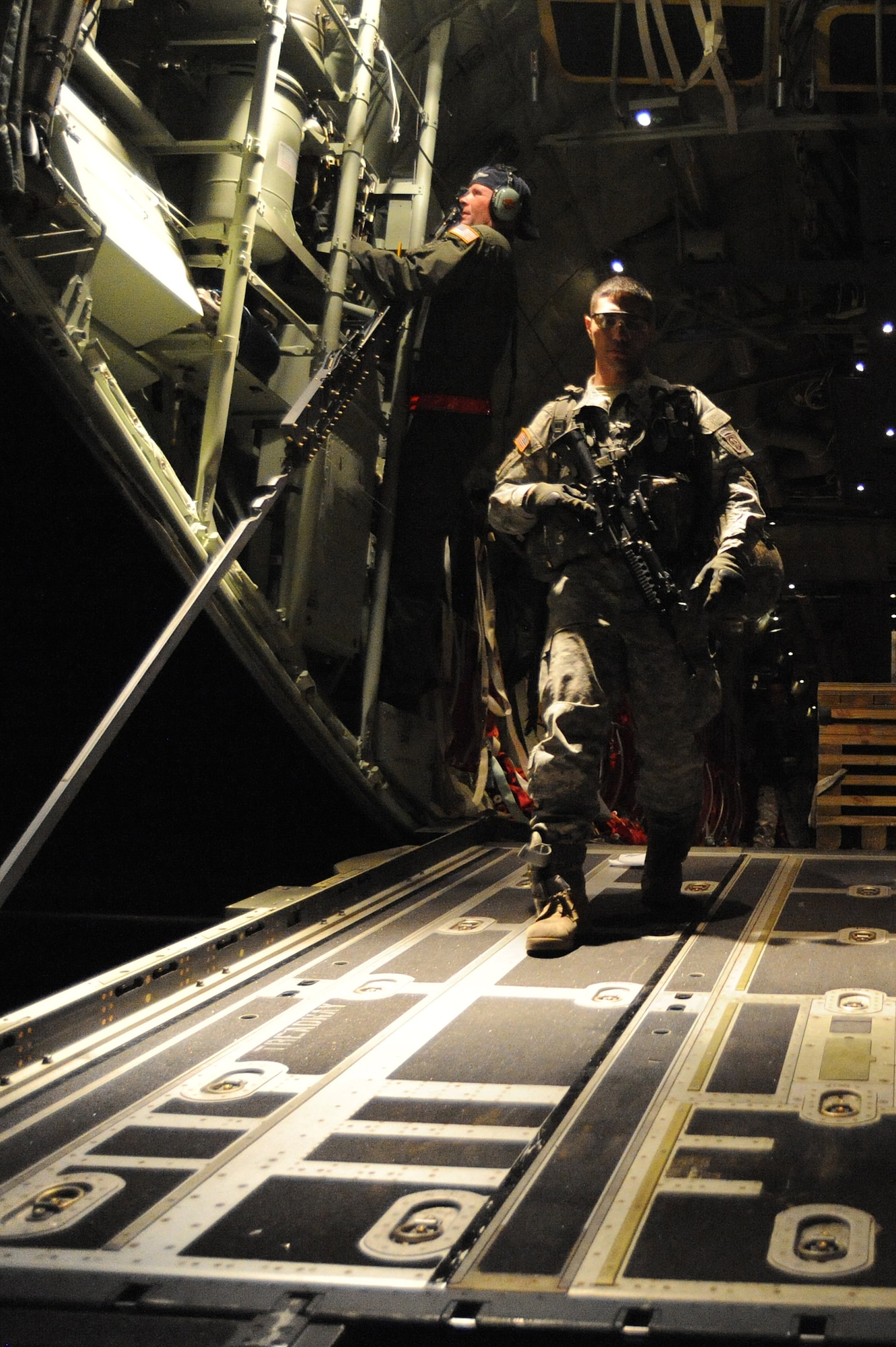 An Army Soldier from the 82nd Airborne Division departs a C-130J Hercules at Port-au-Prince International Airport Jan. 16, 2010 to support the earthquake relief effort in Haiti. Soldiers from the 82nd Airborne will be providing security, medical support and command for the military members supporting Operation Unified Response Haiti.  (U.S. Air Force photo/Staff Sgt. Chad Chisholm)