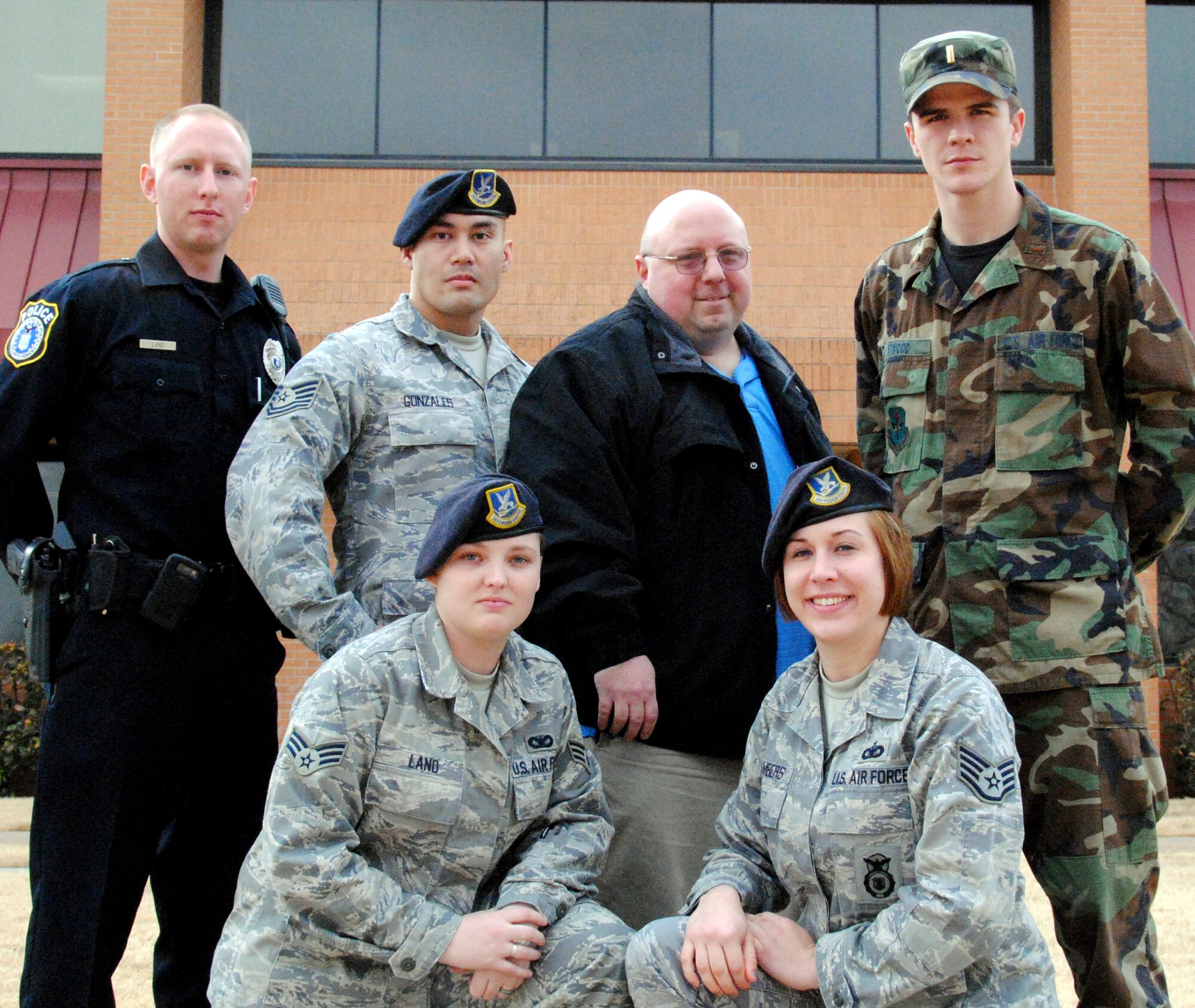 Warriors of the Week -- front row from left, Senior Airman Kaleigh Land and Staff Sgt. Jennifer Chambers; back row from left, Officer Andrew Land, Tech. Sgt. Joe Gonzales, Scott Boas and 2nd Lt. Trent Atwood. (U.S. Air Force photo/ Joe B. Wiles)