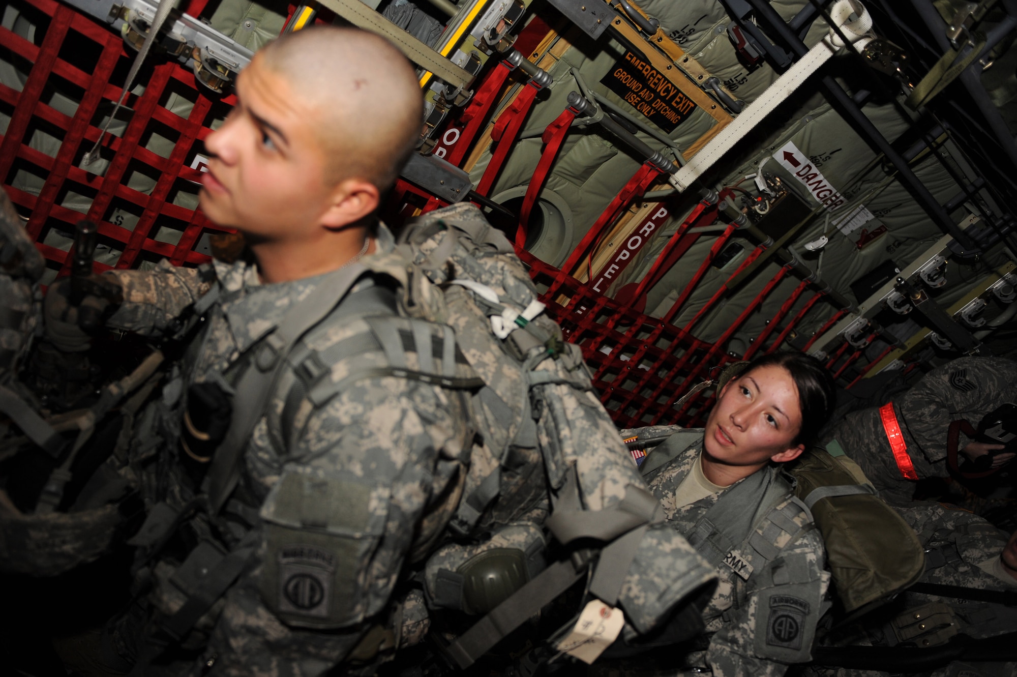 U.S. Army Pfc. Jami Dater and Pfc. Harry Kroll, 82nd Airborne Military Police, enter a C-130J Hercules from the 41st Airlift Squadron at Little Rock Air Force Base, Ark., prior to taking off for the Port-au-Prince International Airport, Haiti Jan. 16, 2010.  Pfc. Dater and Pfc. Harry Kroll will be conducting security and humanitarian support during the earthquake relief in support of Operation Unified Response. (U.S. Air Force photo/Staff Sgt. Chad Chisholm)