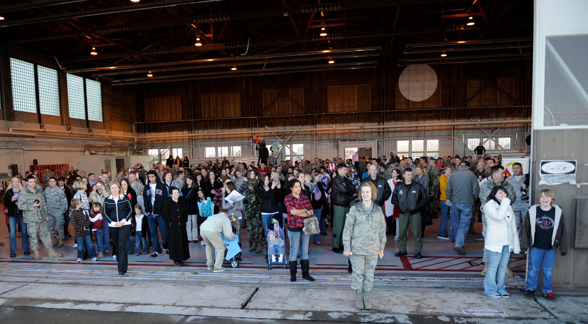 MOUNTAIN HOME AIR FORCE BASE, Idaho -- Families of the 398th Fighter Squadron watch in Hangar 201 as their loved ones return from a four-month deployment to the Republic of Korea Jan. 20. More than 300 members of the 389th FS return from their deployment in support of U.S. Government and Department of Defense global engagement strategies. (U.S. Air Force photo by Airman 1st Class Renishia Richardson)