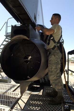 Airman 1st Class Graham Robinson performs maintenance on a C-17 engine here after a reverse engine thruster is damaged in flight en route from Haiti back to Charleston AFB Jan 19. The C-17 from McChord Air Force Base was recently repaired and is one of many C-17s tasked for relief missions.The humanitarian efforts have been both joint and coalition. Airman Robinson is an aircraft maintenance technician assigned to the 437th Aircraft Maintenance Squadron. (U.S. Air Force photo/Airman 1st Class Lauren Main)