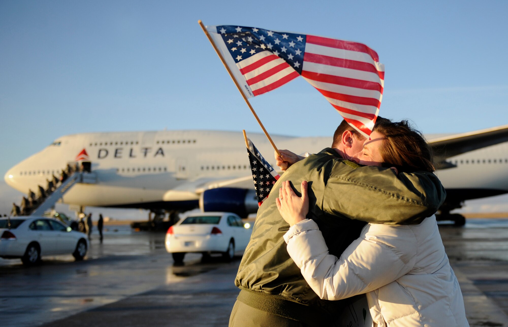MOUNTAIN HOME AIR FORCE BASE, Idaho -- Lt. Col. Evan Pettus, 389th Fighter Squadron commander reunites with his wife, Kirsten Pettus, after returning from a four-month deployment to the Republic of Korea Jan. 20. More than 300 members of the 389th FS return from their deployment in support of U.S. Government and Department of Defense global engagement strategies. (U.S. Air Force photo by Airman 1st Class Renishia Richardson)
