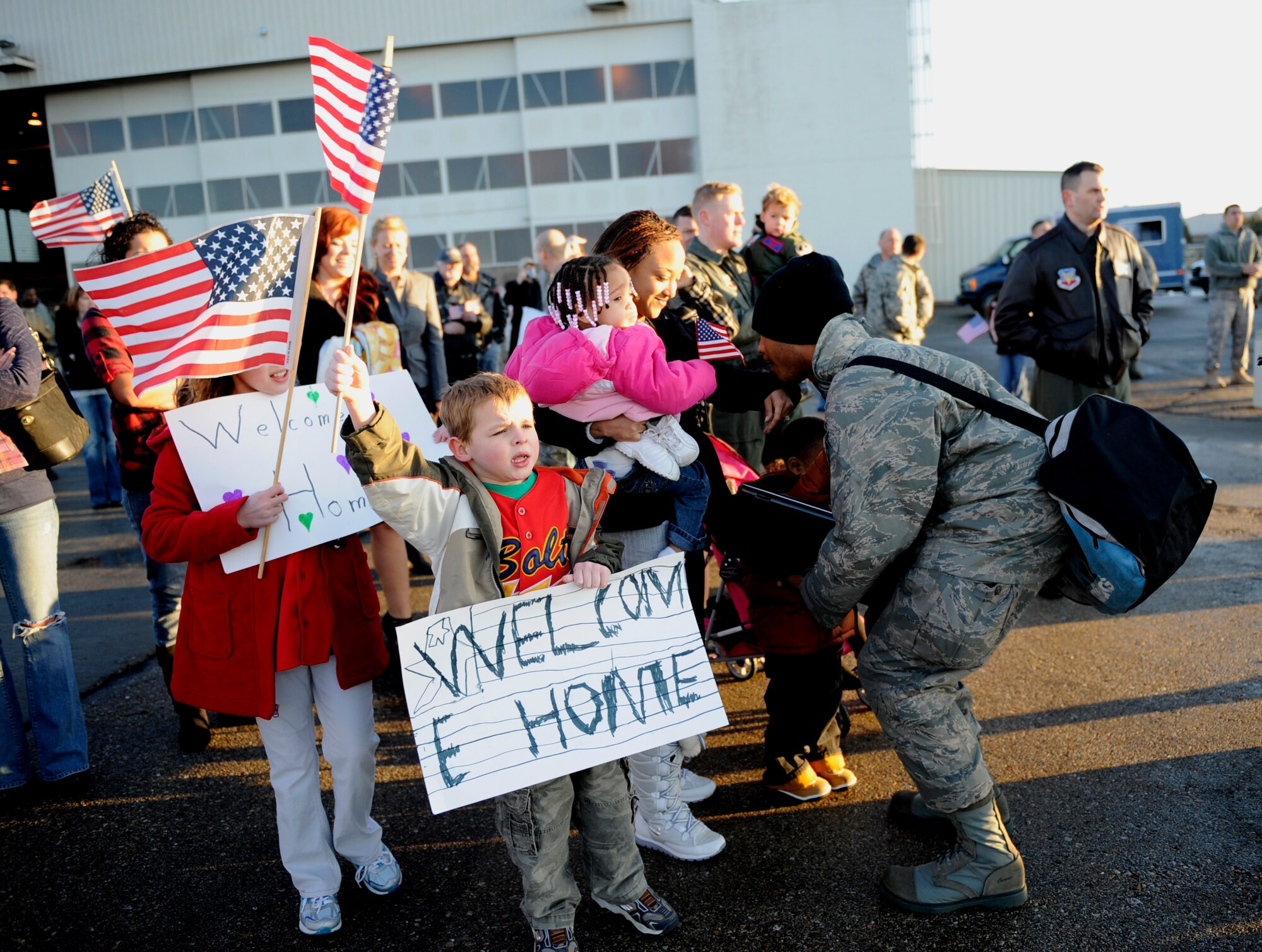 MOUNTAIN HOME AIR FORCE BASE, Idaho -- Families of the 398th Fighter Squadron watch in Hangar 201 as their loved ones return from a four-month deployment to the Republic of Korea Jan. 20. More than 300 members of the 389th FS return from their deployment in support of U.S. Government and Department of Defense global engagement strategies. (U.S. Air Force photo by Airman 1st Class Renishia Richardson)