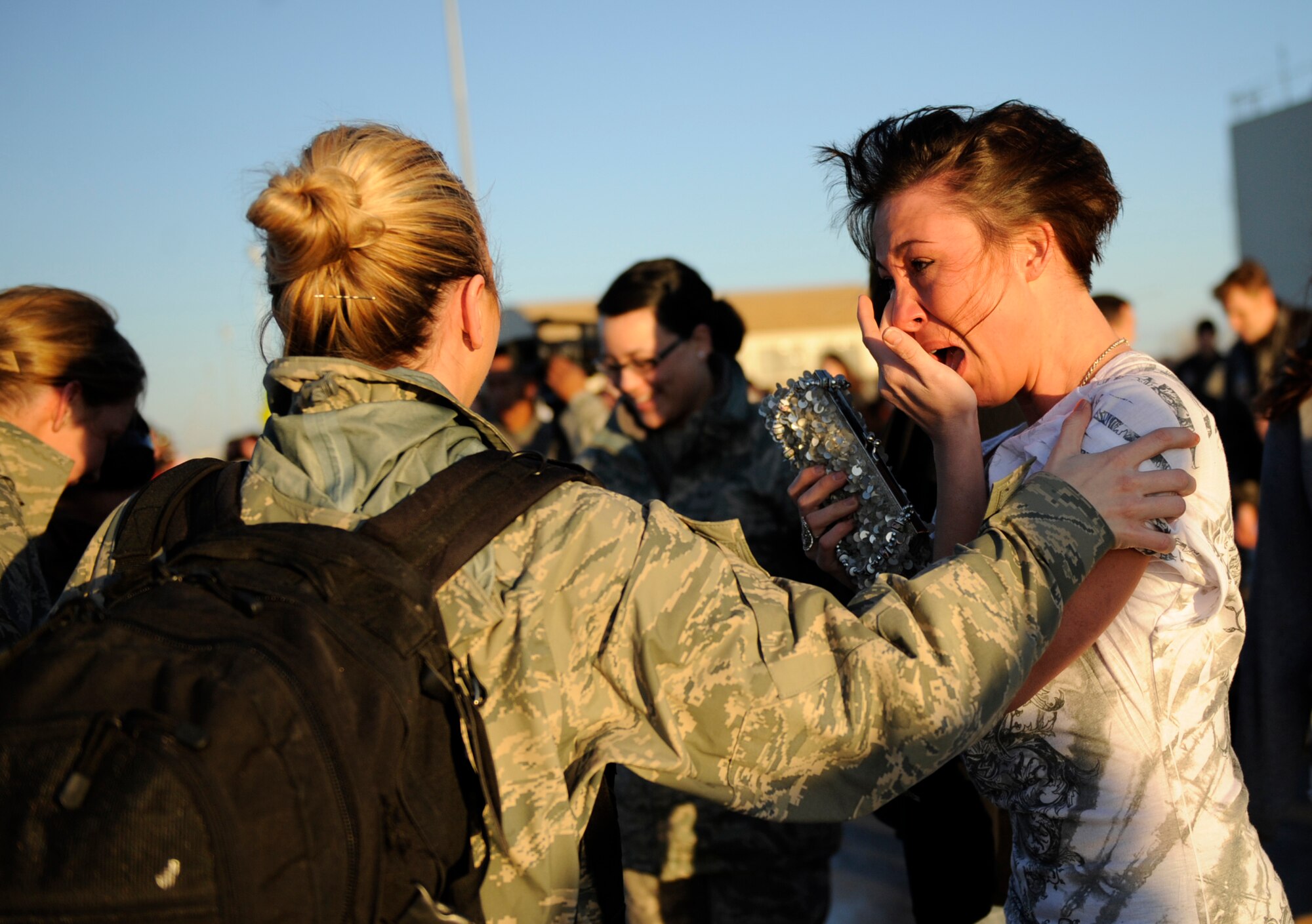 MOUNTAIN HOME AIR FORCE BASE, Idaho -- Senior Airman Miranda Wilson, 366th Aircraft Maintenance Squadron, reacts when she welcomes back Staff Sgt. Tiffany Ryan, 366th Aerospace Medical Squadron medical technician, from a four-month deployment to the Republic of Korea Jan. 20. More than 300 members of the 389th Fighter Squadron return from their deployment in support of U.S. Government and Department of Defense global engagement strategies. (U.S. Air Force photo by Airman 1st Class Renishia Richardson)