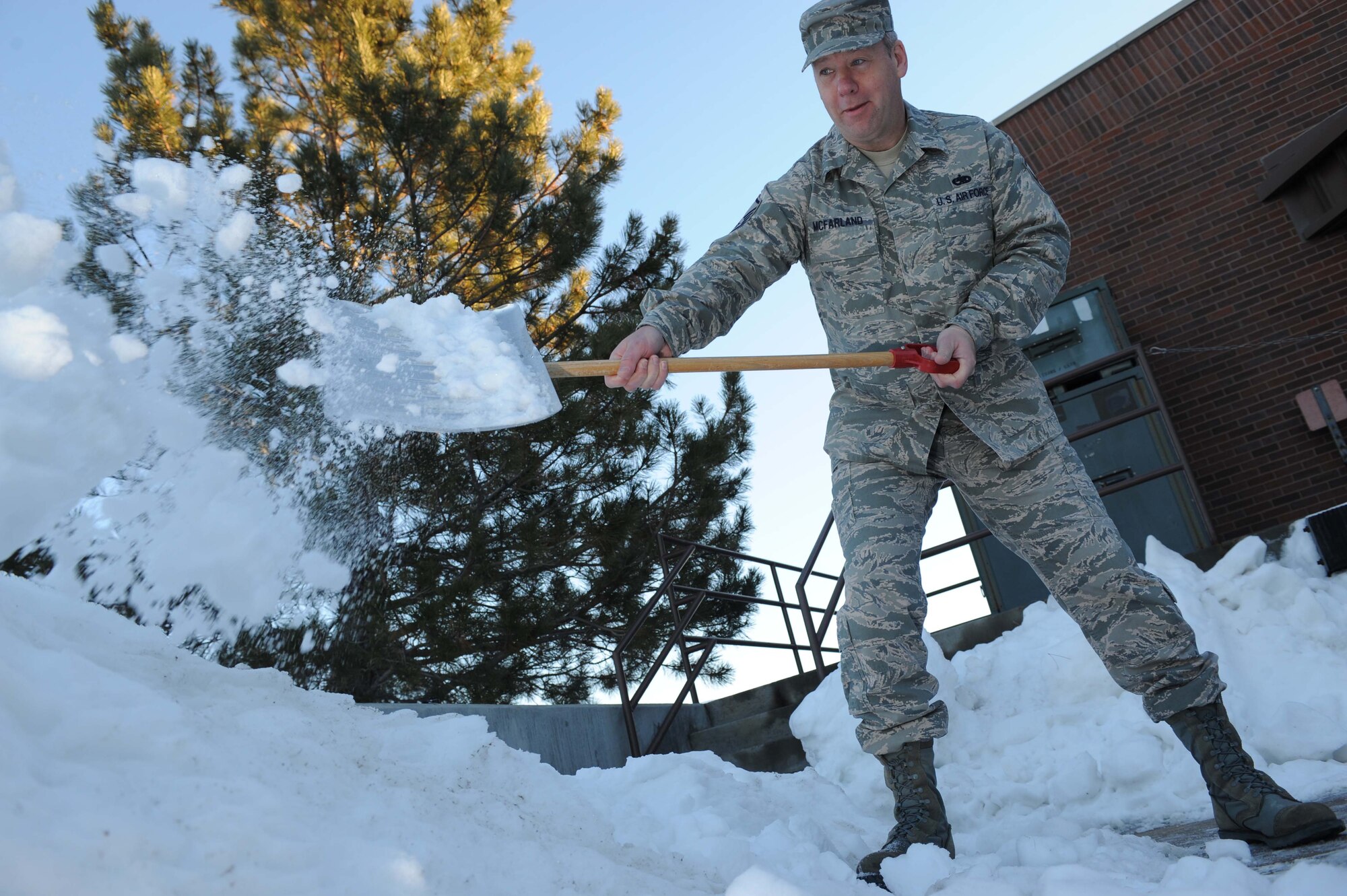 ELLSWORTH AIR FORCE BASE, S.D.-- Master Sgt. Mark McFarland, 28th Bomb Wing planning NCO In-Charge, shovels snow after a 3 to 5 inch snowfall, Jan. 12. The average annual amount of snowfall in South Dakota is 24 to 30 inches across most of the state, and 60 to 100 inches in the Black Hills. (U.S. Air Force photo/Airman 1st Class Corey Hook)