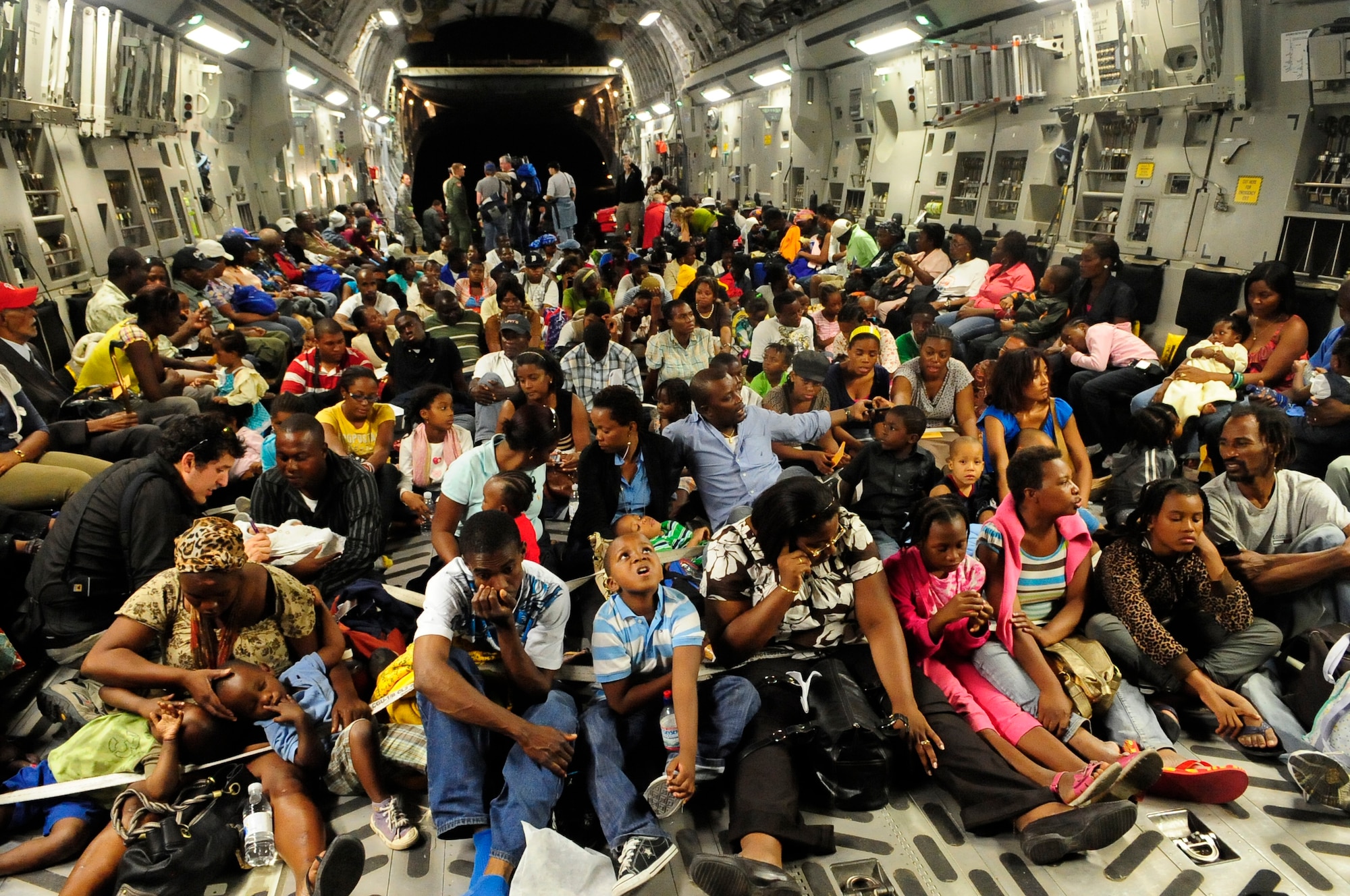 A McChord C-17 Globemaster III is filled with approximately 186 evacuees from Port-Au-Prince, Haiti.  The McChord aircrew airlifted the evacuees to Orlando International Airport in Orlando, Fla. from Toussaint L’Ouventure International Airport Sunday. (U.S. Air Force photo/Master Sgt. Chris Haylett)