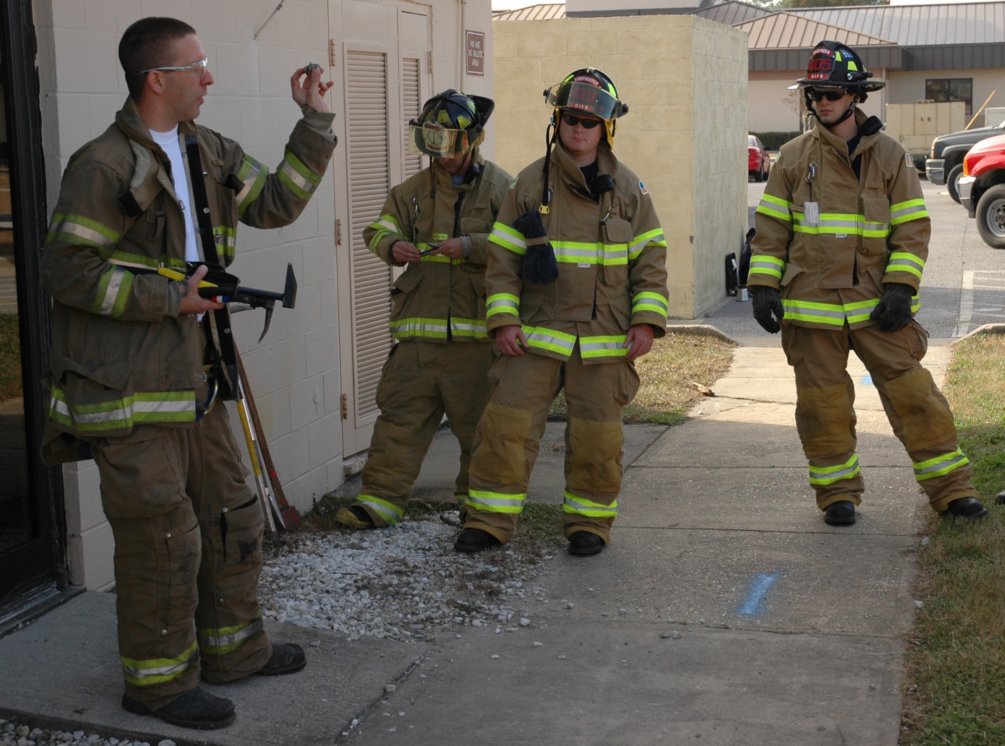 Curt Isaacson, Escambia County Fire Department battalion chief, holds up a door lock to firefighters during the Joint Okaloosa County Training event at the old Hurlburt Field Fire Department Jan. 13. Chief Isaacson taught sections how to force open different types of doors and break through certain locks to get inside a building. (U.S. Air Force photo by Airman 1st Class Joe McFadden)