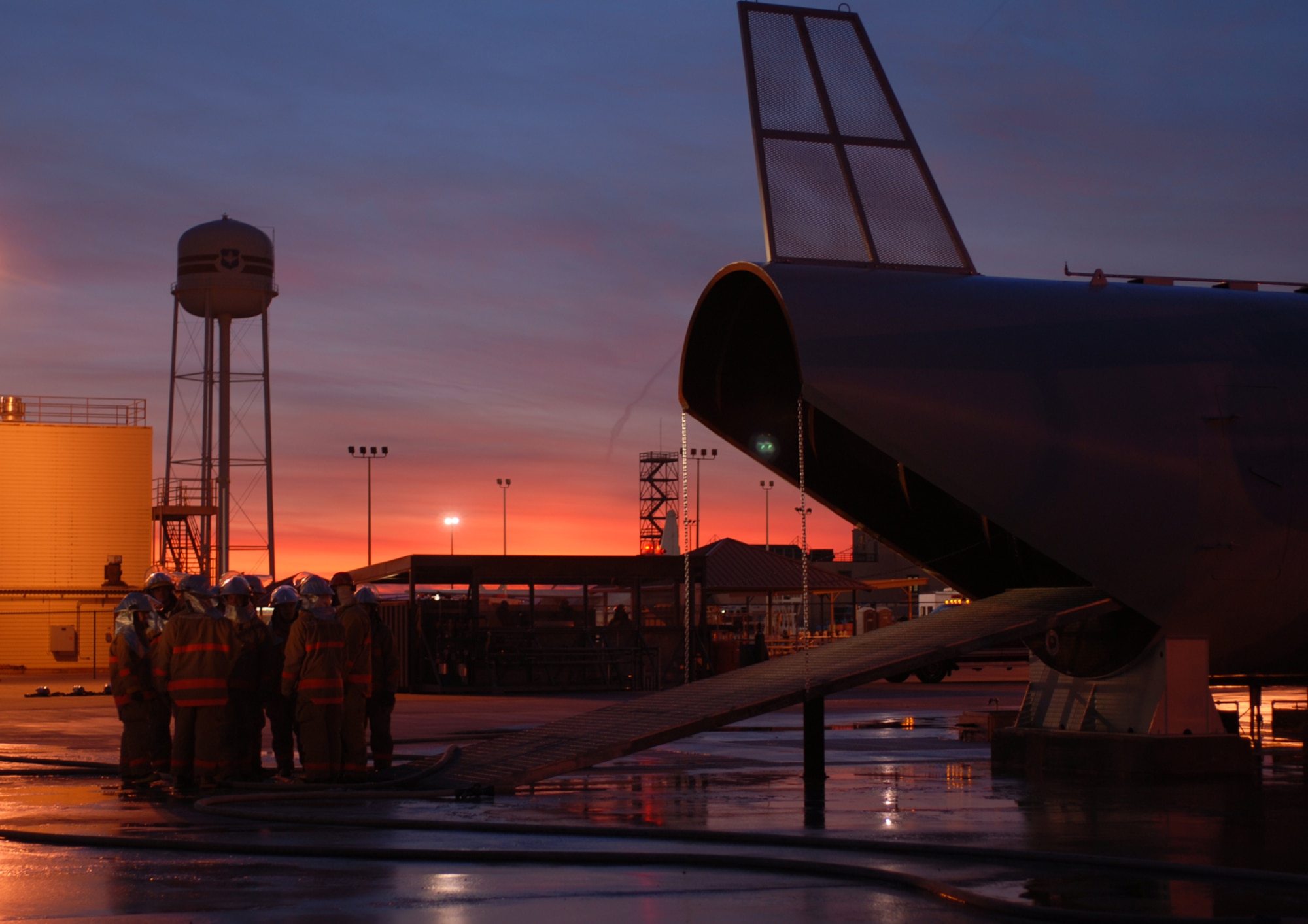 GOODFELLOW AIR FORCE BASE, Texas -- The sun rises over the Louis F. Garland Department of Defense Fire Academy as students and instructors prepare to begin the day's training on the new large frame aircraft trainer, Jan. 11, 2010. The academy provides training to all branches of the DoD to include civil service firefighters. Fire protection specialists from numerous foreign countries also train at the academy. (U.S. Air Force photo/Staff Sgt. Laura R. McFarlane)
