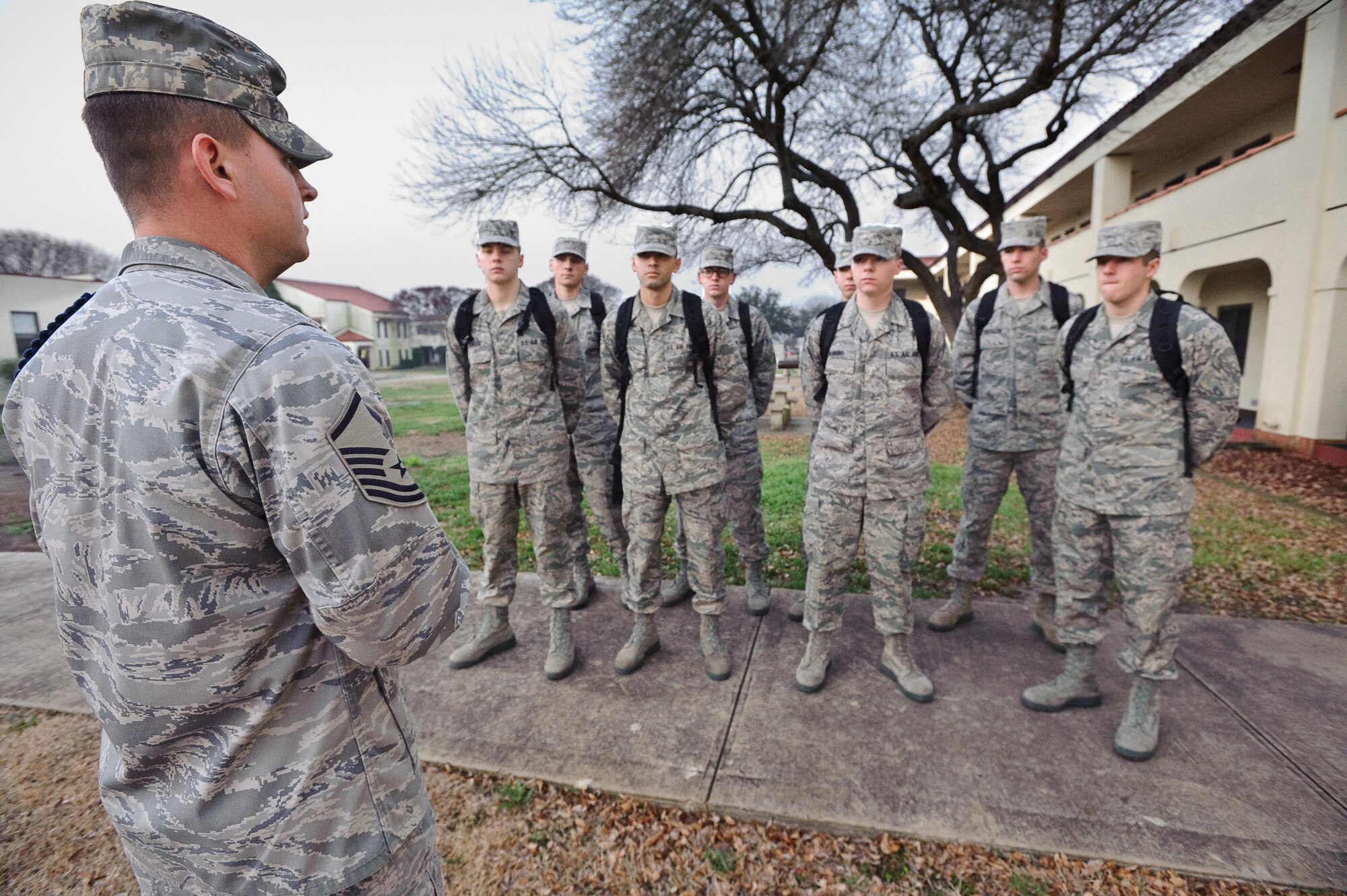 Master Sgt. Sammy Garvin, a Military Training Leader with the 12th Operations Group, Det. 1, reviews administrative issues during morning formation with the first eight non-prior service students assigned to the Basic Sensor Operators Course taught at Randolph, Air Force Base, Texas, Jan. 20, 2010. (U.S. Air Force photo/Steve Thurow)