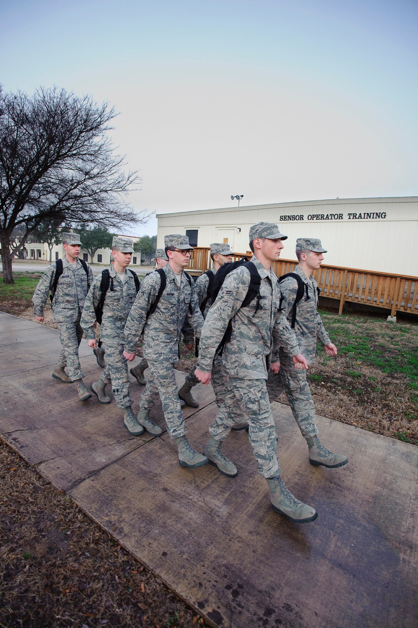 Non-prior service students march to class during the first week of their Basic Sensor Operator Course taught by 12th Operations Group, Det., by Remotely Piloted Aircraft sensor operator instructors at Randolph Air Force Base, Texas, Jan. 20, 2010. (U.S. Air Force photo/Steve Thurow)

