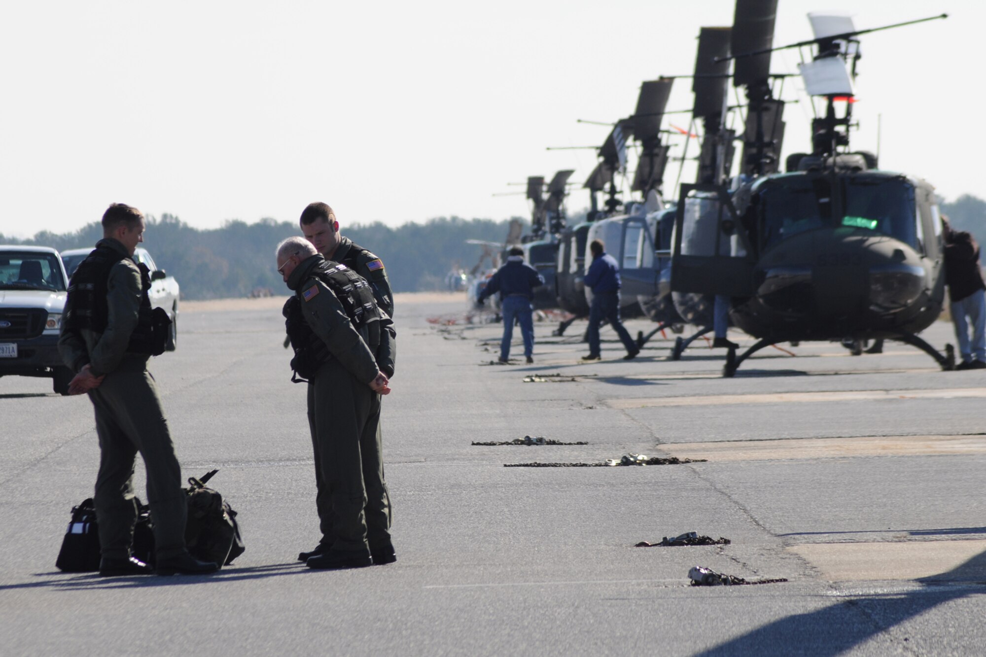 Student pilots from the 23rd Flying Training Squadron at Fort Rucker, Ala., meet with their instructor before takeoff for a training mission. The 23rd FTS is the third and final phase of undergraduate pilot training before the student pilots can obtain their wings.  It is the Air Force's primary source of helicopter pilot training for special operations, combat search and rescue, missile support and distinguished visitor airlift missions. (U.S. Air Force photo/Airman 1st Class Anthony Jennings)