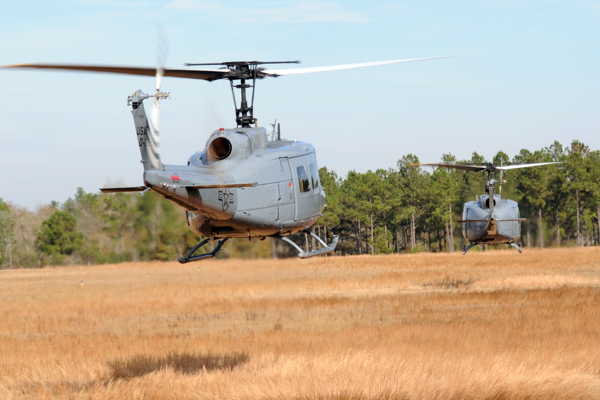Students from the 23rd Flying Training Squadron at Fort Rucker, Ala., piloting UH-1H Iroquois helicopters, practice landing during formation-flight patterns. The 23rd FTS is the third and final phase of undergraduate pilot training before the student pilots can obtain their wings.  It is the Air Force's primary source of helicopter pilot training for special operations, combat search and rescue, missile support and distinguished visitor airlift missions. (U.S. Air Force photo/Airman 1st Class Anthony Jennings)
