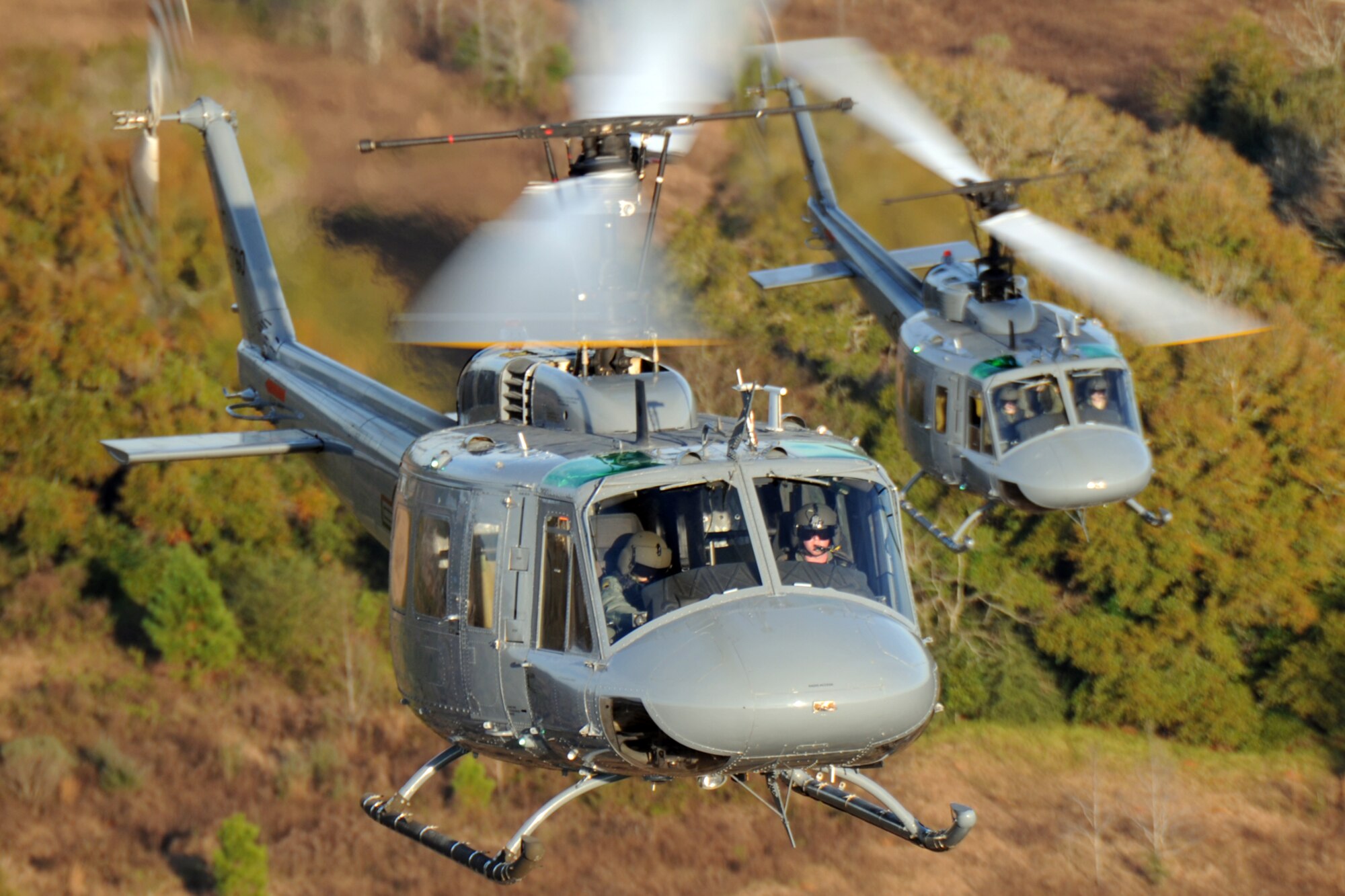 Students from the 23rd Flying Training Squadron at Fort Rucker, Ala., piloting UH-1H Iroquois helicopters, practice formation-flight patterns.  The 23rd FTS is the third and final phase of undergraduate pilot training before the student pilots can obtain their wings.  It is the Air Force's primary source of helicopter pilot training for special operations, combat search and rescue, missile support and distinguished visitor airlift missions. (U.S. Air Force photo/Airman 1st Class Anthony Jennings)