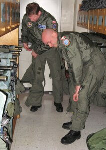 Second Lt. Reg Reimer (left) and 2nd Lt. Bertram Cronshaw (right), student pilots in the 459th Flying Training Squadron, suit up before a flight Jan. 13. The two pilots are the first Canadian student pilots to ever participate in the Euro-NATO Joint Jet Pilot Training program. After their training at Sheppard, they will have follow-on training in Canada. (U.S. Air Force Photo / Airman 1st Class Adawn Kelsey)