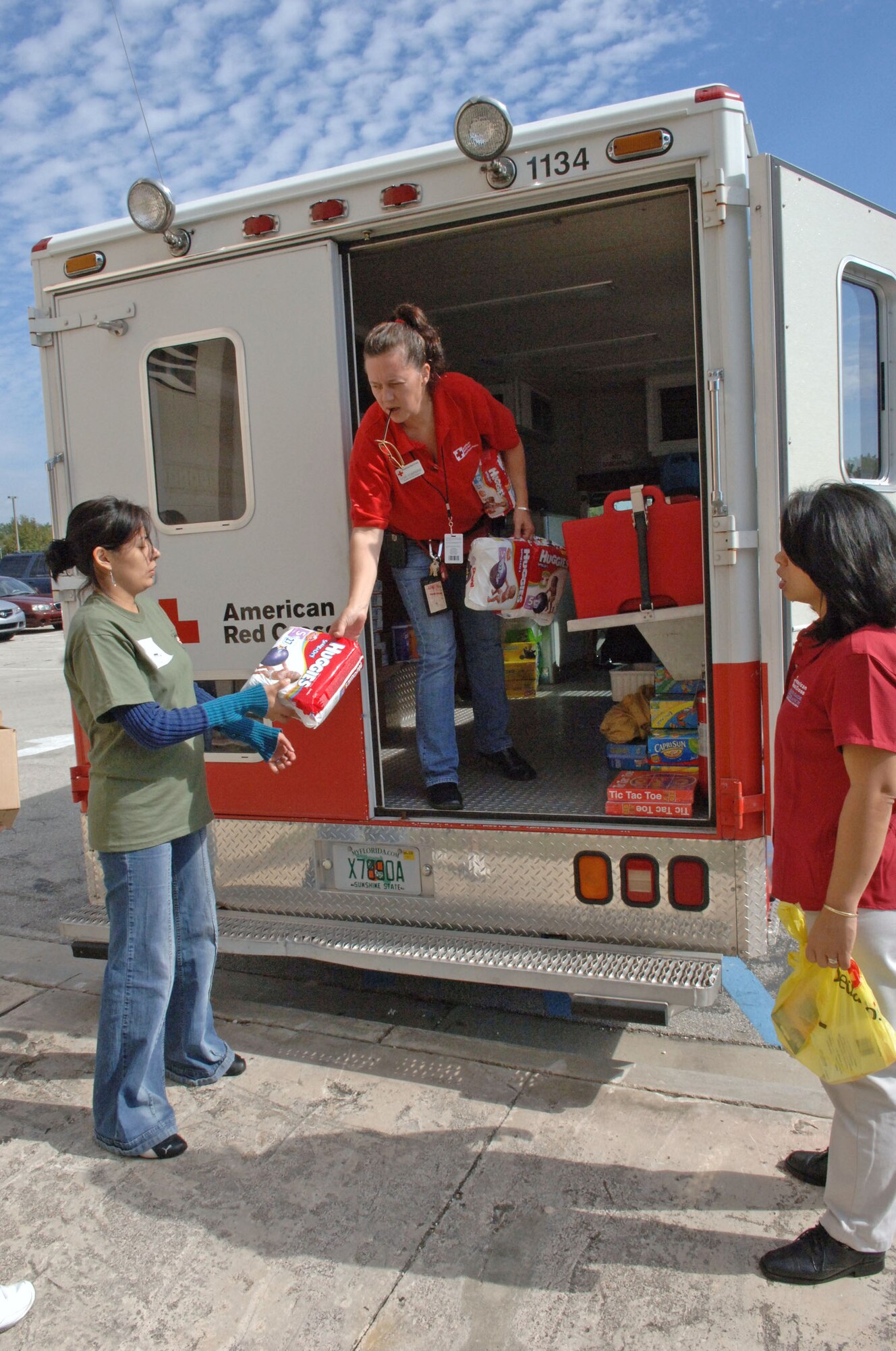 Red Cross volunteers unload diapers for displaced evacuees from Haiti, Jan. 19, 2010, at Homestead Air Reserve Base, Fla. The Red Cross supported more than 1,500 evacuees being transported through Homestead ARB. (U.S. Air Force photo/Tech. Sgt. Andy Bellamy)
