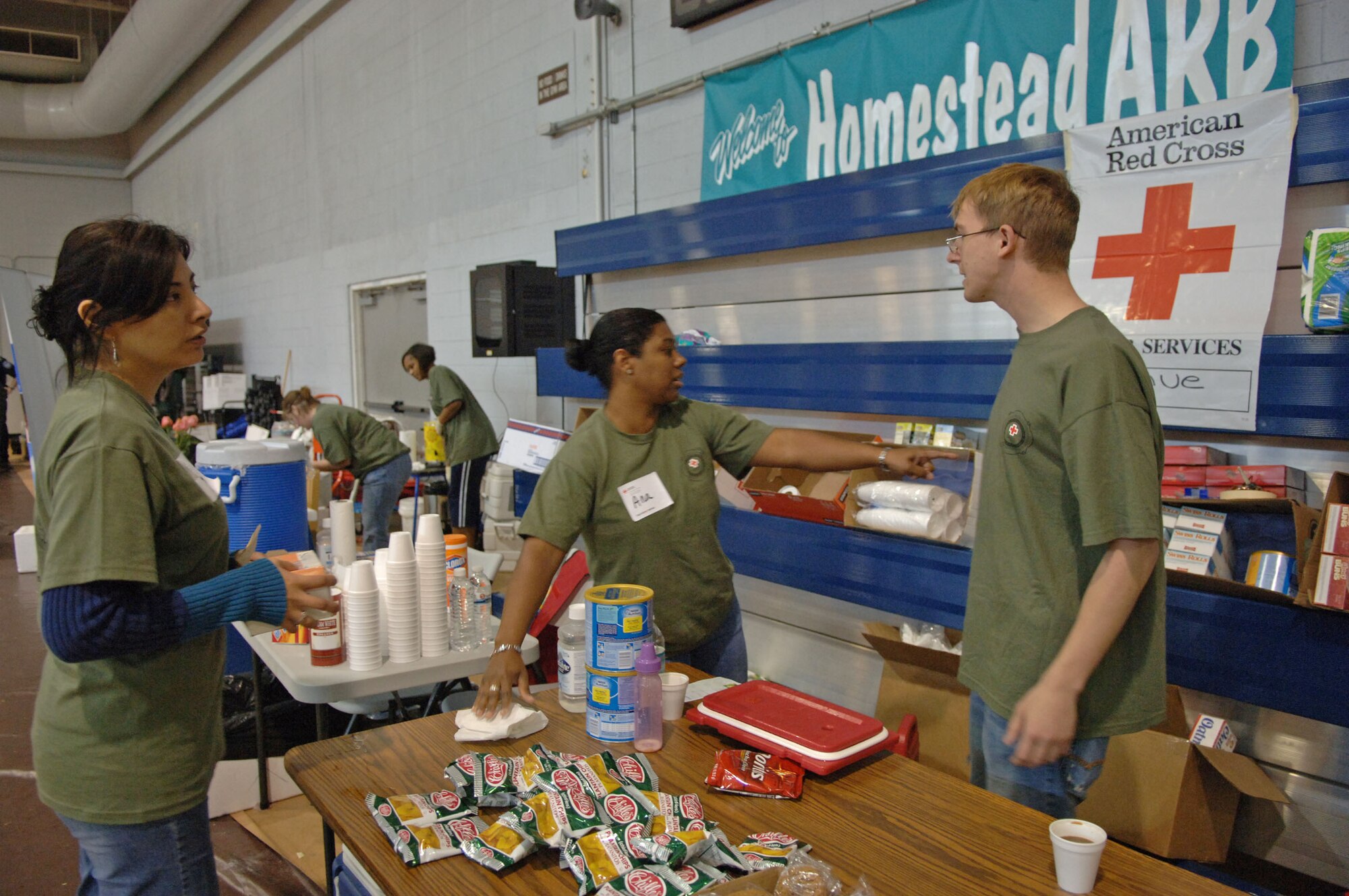 Red Cross volunteers prepare food and snacks for evacuees from Haiti, Jan. 19, 2010, at Homestead Air Reserve Base, Fla. The Red Cross has already supported more than 1,500 evacuees being transported through Homestead ARB. (U.S. Air Force photo/Tech. Sgt. Andy Bellamy)
