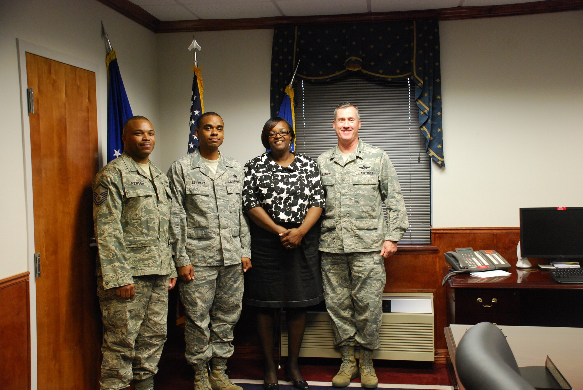 Brig. Gen. O.G. Mannon (far right), 82nd Training Wing commander, coined members of the African-American Heritage Committee Jan. 19 for their work in planning the Martin Luther King Jr. Luncheon held Jan. 12. The AAHC members pictured from left to right are: Master Sgt. Antwan Newsom, the 82nd Training Group AAHC advisor and an instructor from the 361st Training Squadron; Tech. Sgt. Jeremy Stewart, the AAHC president and instructor from the 362nd TRS; and Valerie Berry, the AAHC vice president and 372nd TRS secretary. (U.S. Air Force photo/Airman 1st Class Valerie Hosea)