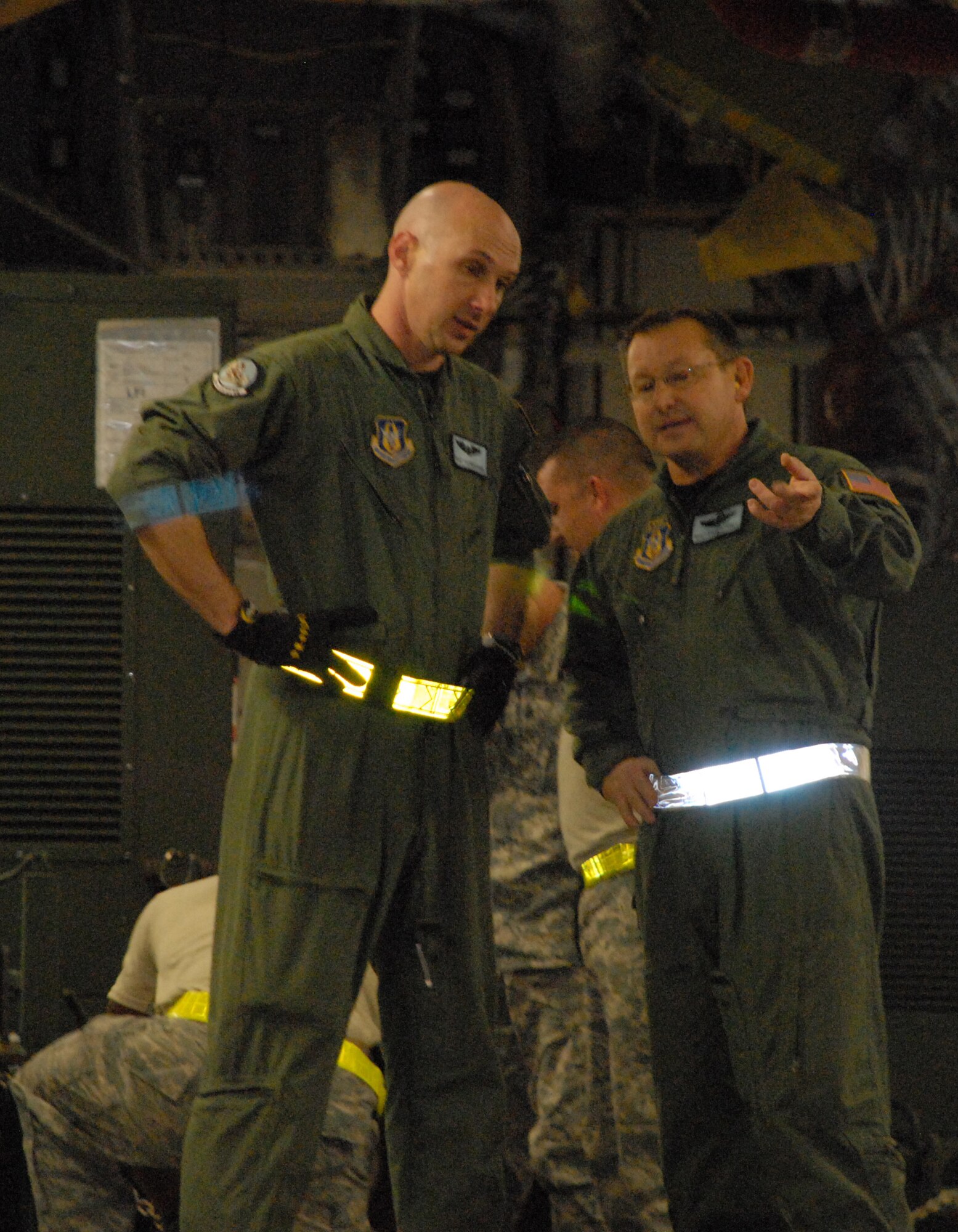(Left) Staff Sgt. Patrick Burk and Master Sgt. Steven Jones, 326th Airlift Squadron loadmasters, direct the loading of a Dover Air Force Base C-17 Globemaster III Jan. 15 at MacDill AFB, Fla., with Joint Communications Support Element equipment to be transported to Port-au-Prince, Haiti. The JCSE provides early entry communication support for Regional Combatant Commands, Special Operations Command, and other U.S. agencies. (U.S. Air Force photo/2nd Lt Adam Gregory)