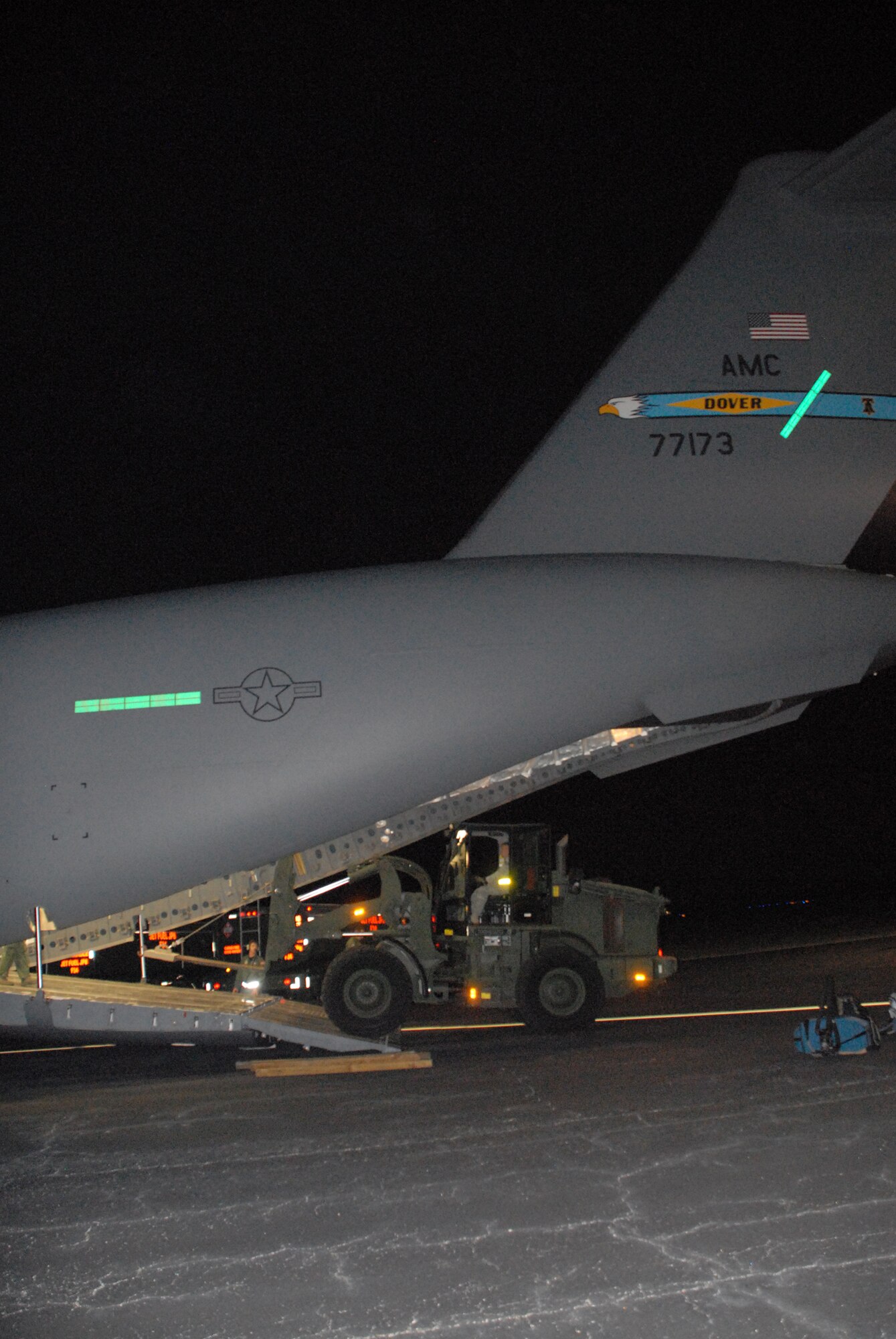 Airman load Joint Communications Support Element equipment onto a Dover Air Force Base C-17 Globemaster III Jan. 15 at MacDill AFB, Fla. The equipment and team were delivered to Port-au-Prince, Haiti during the early morning hours of Jan 16. The JCSE team sets up reach-back capabilities in theater within 72 hours to provide communication for the full spectrum of operations.