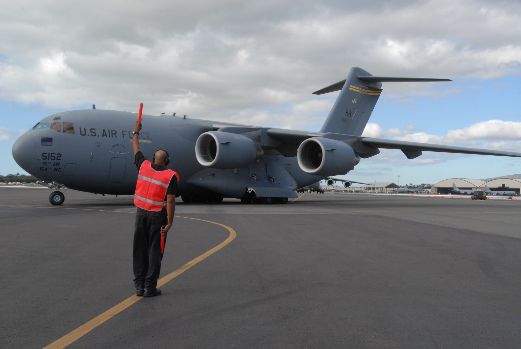 A C-17 Globemaster III departs Hickam Air Force Base, Hawaii, Jan. 19, 2010, to Charleston AFB, S.C. to take part in humanitarian relief efforts in Haiti. (U.S. Air Force photo/Staff Sgt. Mike Meares)