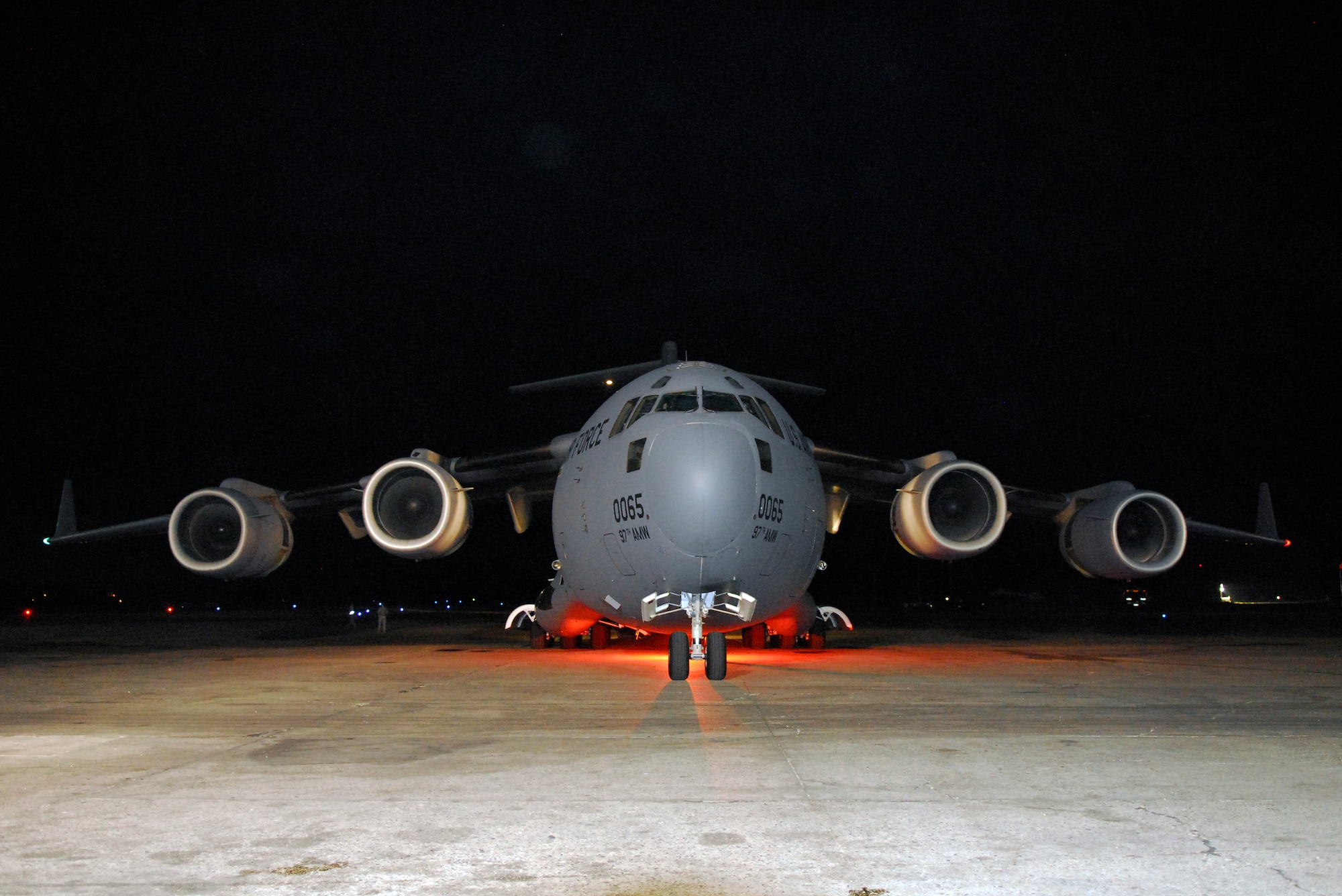 A C-17 Globemaster cargo aircraft laden with vehicles, water, and meals-ready-to-eat sits on the ramp at the Toussaint Louverture International Airport  in Port-au-Prince, Haiti, Jan. 19.  C-17s such as this, based out of Altus Air Force Base, Oklahoma, are typically used for training but have been called in to provide as many supplies to Haiti as quickly as possible.  (U.S. Air Force photo/1st Lt. Matt Schroff)