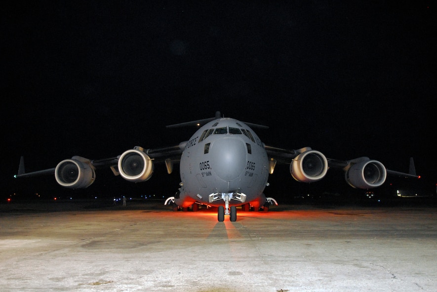 A C-17 Globemaster cargo aircraft laden with vehicles, water, and meals-ready-to-eat sits on the ramp at the Toussaint Louverture International Airport  in Port-au-Prince, Haiti, Jan. 19.  C-17s such as this, based out of Altus Air Force Base, Oklahoma, are typically used for training but have been called in to provide as many supplies to Haiti as quickly as possible.  (U.S. Air Force photo/1st Lt. Matt Schroff)