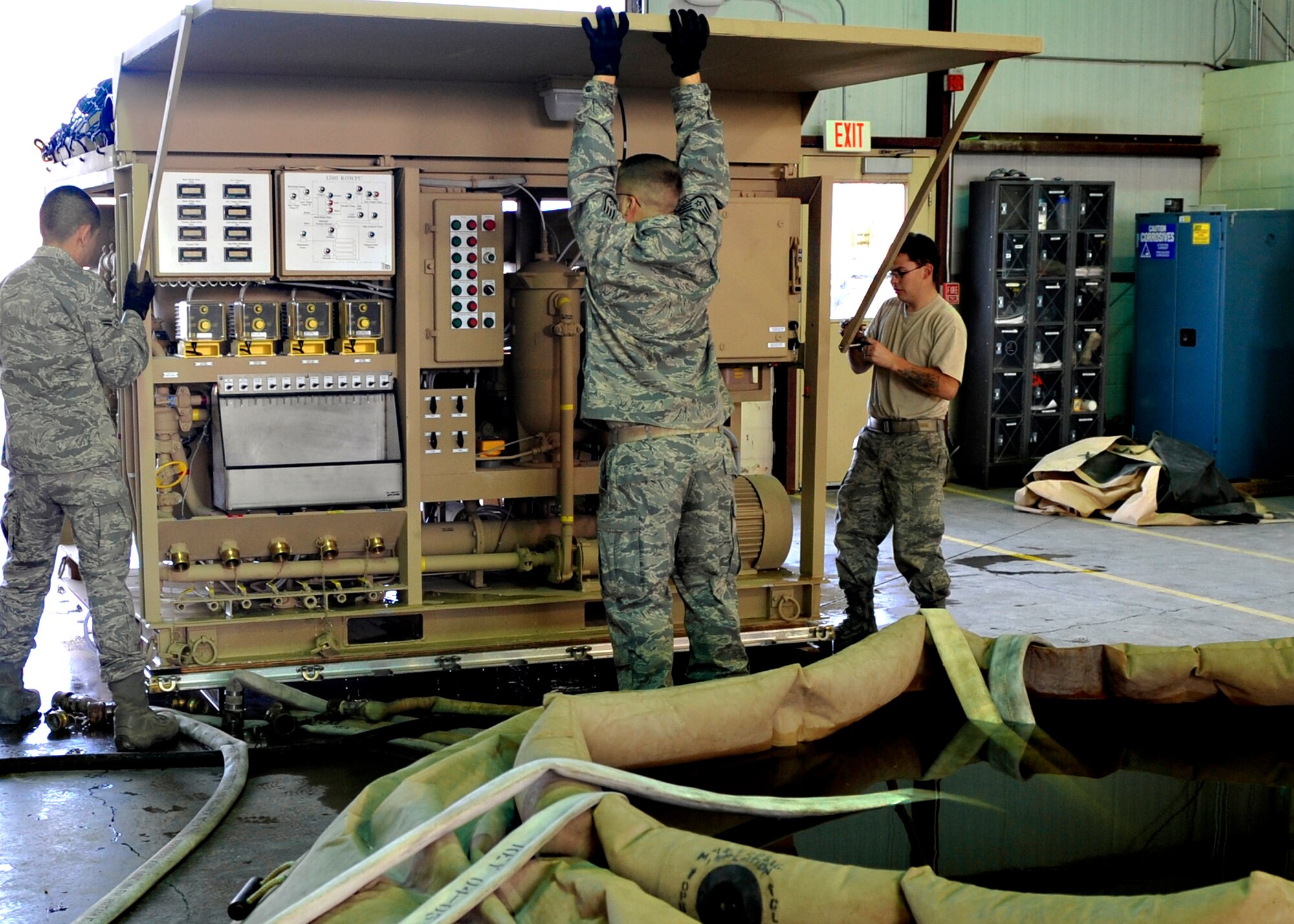 Airmen from the 49th Materiel Maintenance Group at Holloman Air Force Base, N.M., prepare a 1500 reverse osmosis water purification unit, or ROWPU, Jan. 17, 2010, to deploy to Haiti in support of Operation United Response. The base is preparing tents, generators, air conditioning units, ROWPUs and personnel to send to the country after that country was rocked by a magnitude 7 earthquake Jan. 12, leaving thousands dead and even more homeless. (U.S. Air Force photo/Staff Sgt. Anthony Nelson)