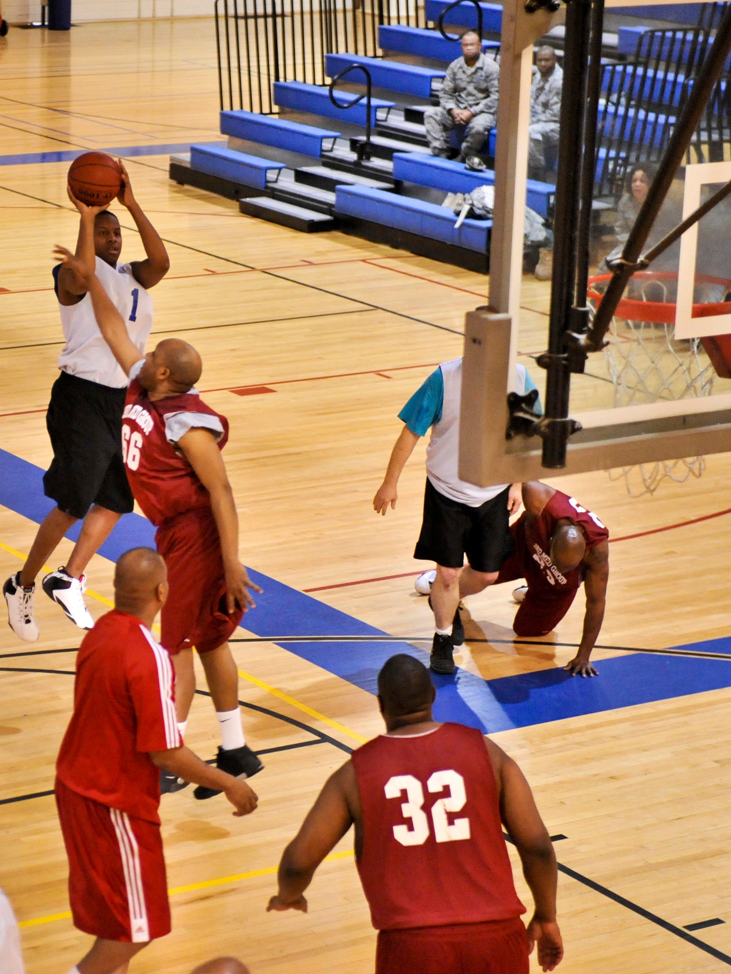 ELMENDORF AIR FORCE BASE, Alaska – The 3rd Force Support Squadron’s Adam Lynk goes up for a jump shot against the 3rd Medical Support Squadron, during the over-30 championship basketball game Jan. 19. The 3rd MDSS won two games in a row to take the base championship. (Air Force photo by Airman 1st Class Christopher Gross)