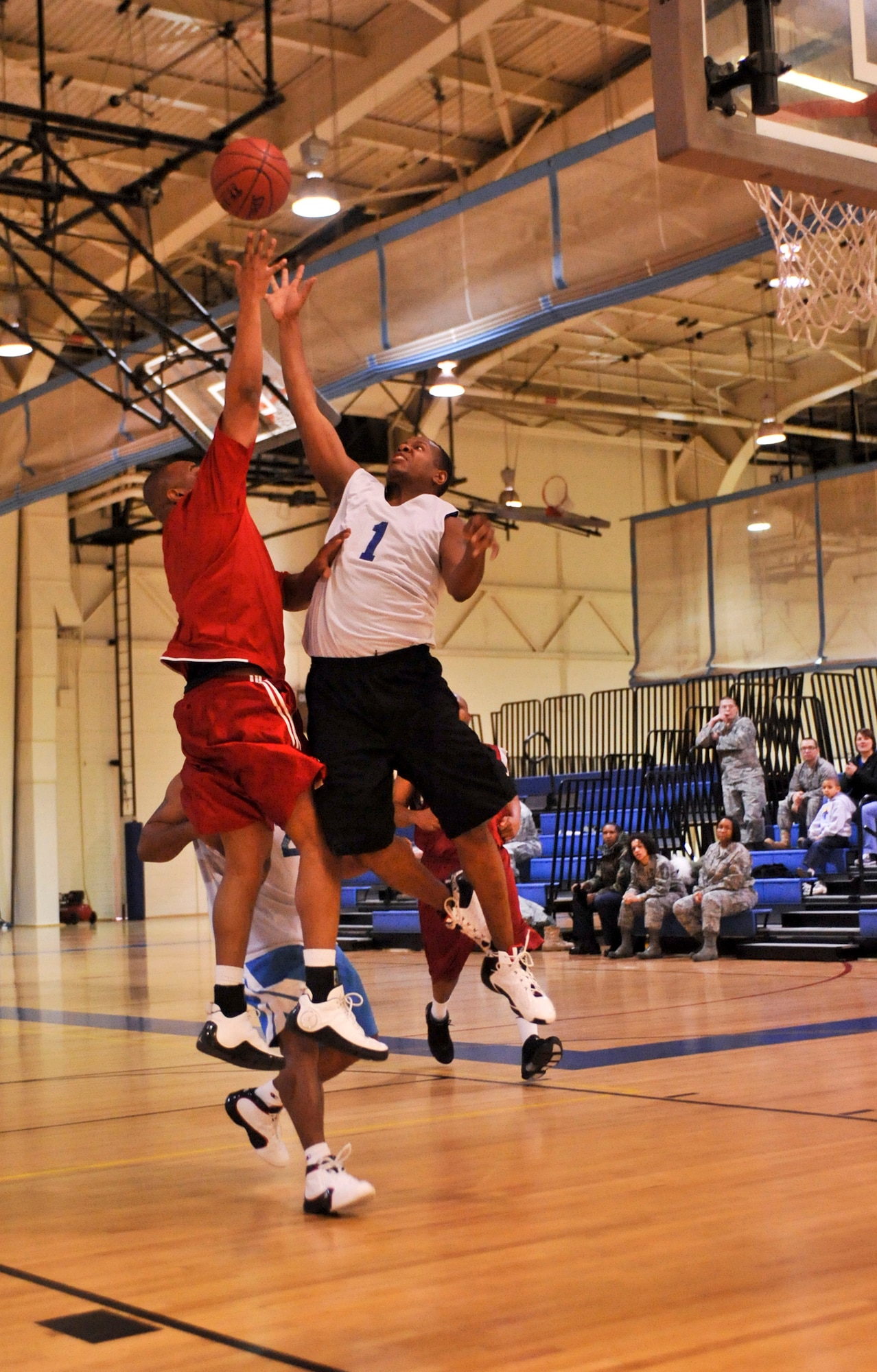 ELMENDORF AIR FORCE BASE, Alaska – The 3rd Force Support Squadron’s Adam Lynk goes up to block the 3rd Medical Support Squadron’s Angel Garcia during the over-30 championship basketball game Jan. 19. The 3rd MDSS won two games in a row to take the base championship. (Air Force photo by Airman 1st Class Christopher Gross)