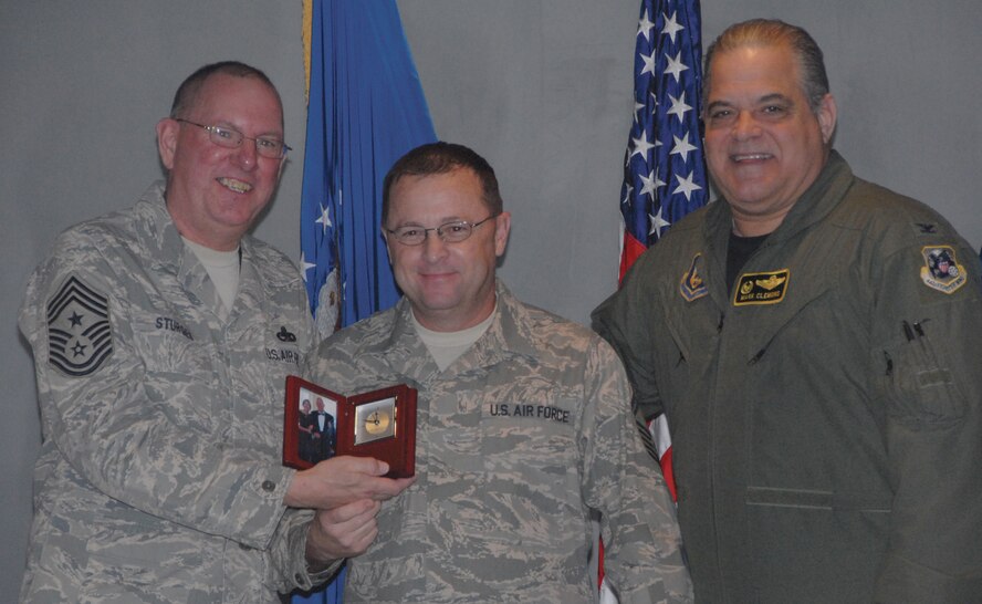 Col. Mark Clemons, 442nd Fighter Wing commander presents Senior Master Sgt. James Nudd of the Fighter Wing staff, with the award for Senior Noncommissioned Officer of the Second Half of 2009. The 442nd Fighter Wing is an Air Force Reserve unit at Whiteman Air Force Base, Mo. (U.S. Air Force photo/Senior Airman Danielle Wolf)