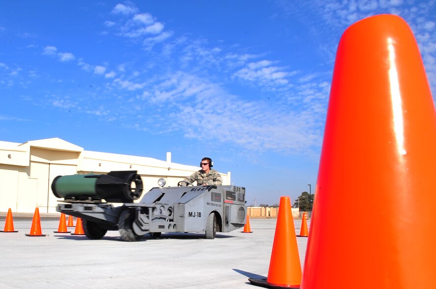 Cones outline the course Senior Airman Charles Cordell, 336th Aircraft Maintenance Unit load crew member, must follow during the jammer competition on Seymour Johnson Air Force Base, N.C., Jan. 15, 2010. A jammer is a vehicle used to lift, carry and move munitions. During the competition, the plastic training bomb was not strapped down making the competition more difficult and exciting. Cordell's time of 1 minute 52 seconds won him third place in the competition, he hails from Anderson, S.C. (U.S. Air Force photo/Airman 1st Class Rae Perry)
