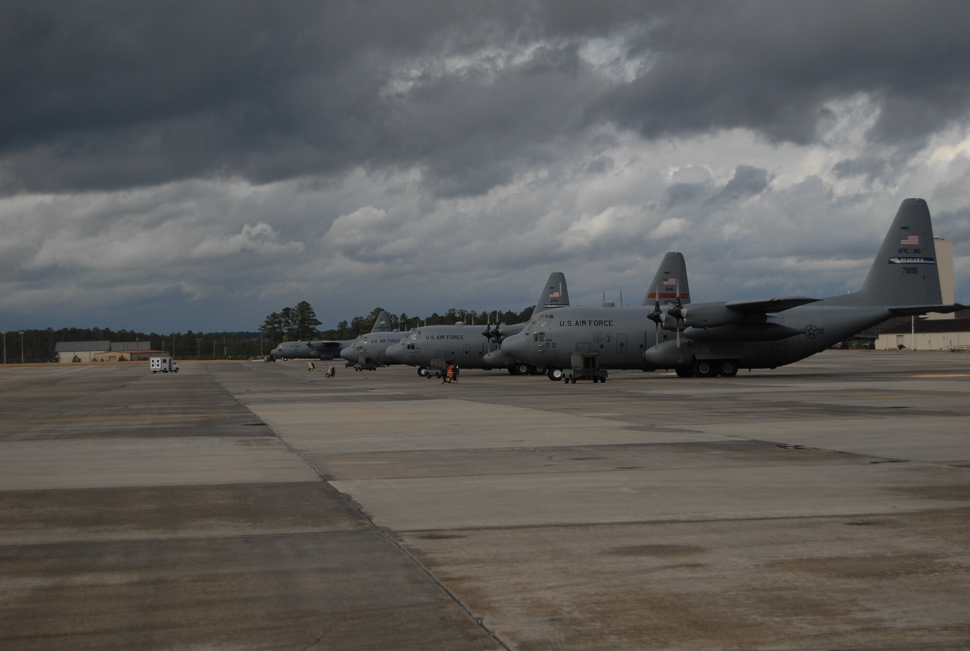 C-130 aircraft from various Air Force active-duty, Guard and Reserve wings sit on Pope’s runway waiting to be loaded with supplies, equipment and personnel Jan. 17. The Aircraft will be taking their cargo to Haiti in support of relief efforts after a 7.0 earthquake devastated the Caribbean nation Jan. 12. Popes airfield is being used as a staging ground for airlift operations, both military and civilian, into Haiti. (U.S. Air Force photo/Senior Airman Kris Levasseur)