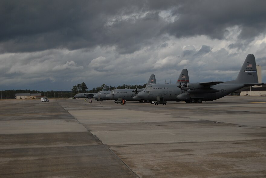 C-130 aircraft from various Air Force active-duty, Guard and Reserve wings sit on the Pope Air Force Base, N.C., flightline waiting to be loaded with supplies, equipment and personnel Jan. 17. The Aircraft will be delivering cargo to Haiti in support of relief efforts after a 7.0 earthquake devastated the Caribbean nation Jan. 12.  Pope AFB is being used as a staging ground for airlift operations, both military and civilian, into Haiti. (U.S. Air Force photo/Senior Airman Kris Levasseur) 